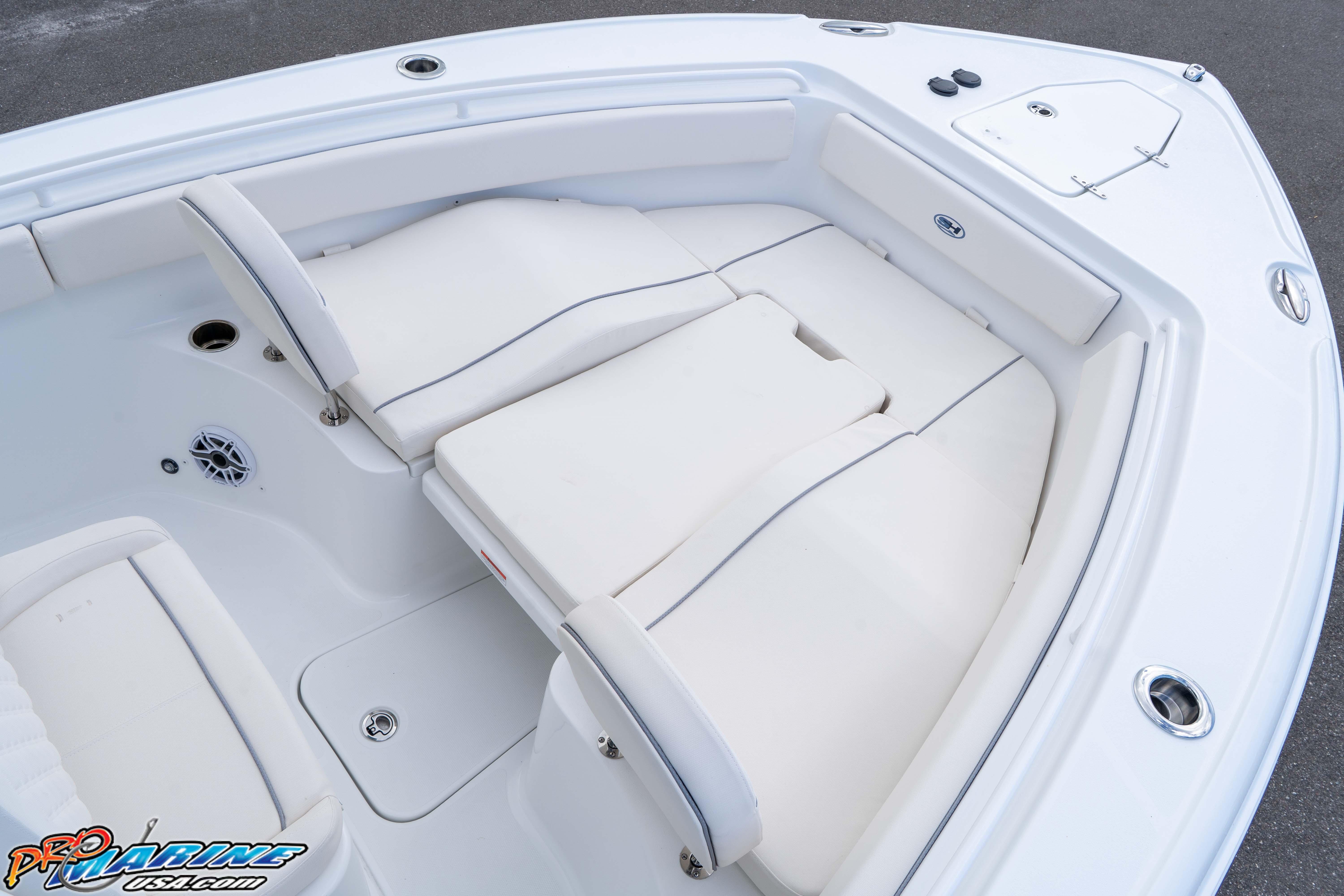 2026 Sea Hunt Ultra 265 SE boat interior with white cushioned seating.