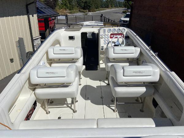 2002 Advantage Victory boat interior with white seating and control panel.