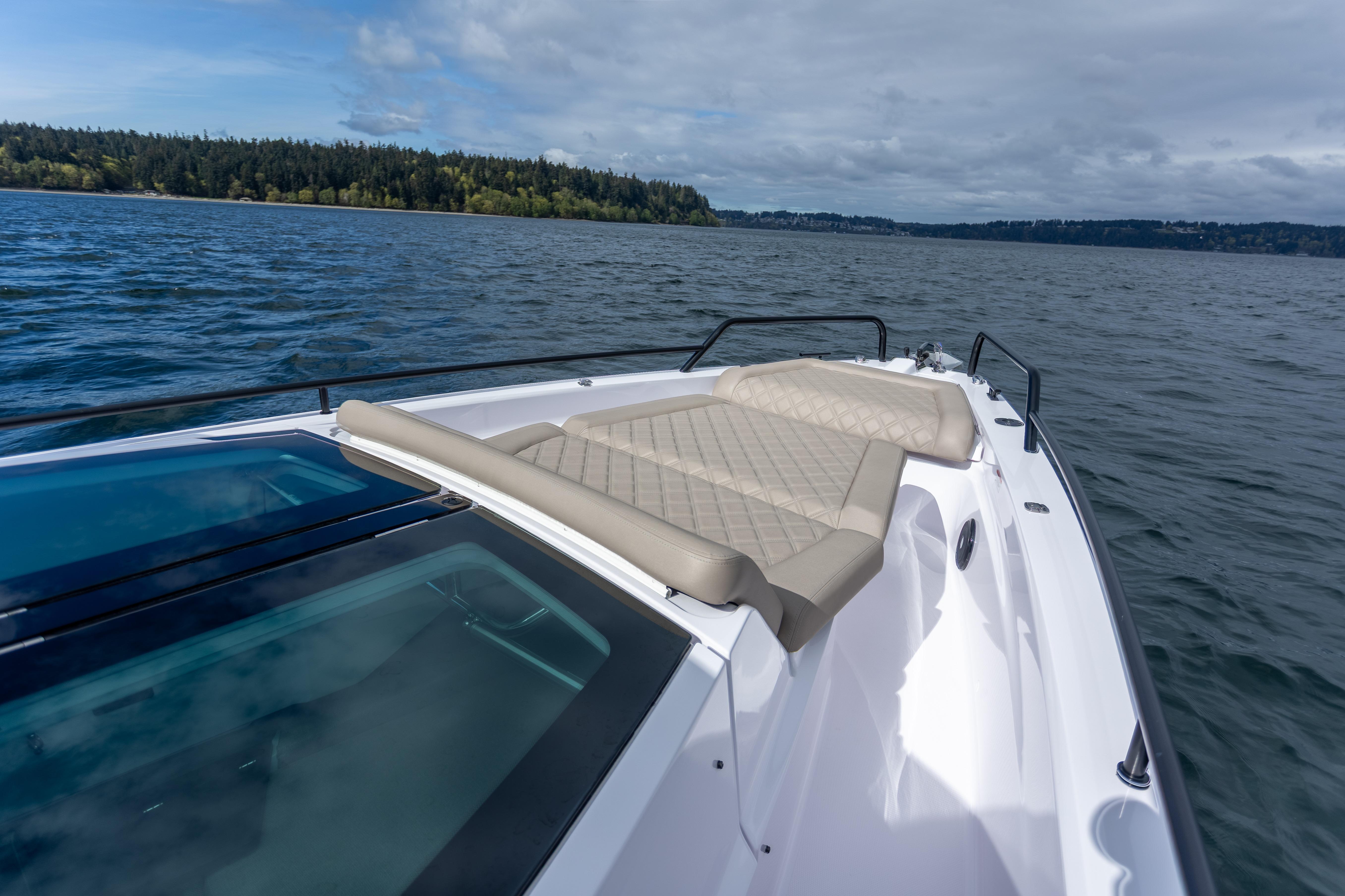 2022 Axopar 37 XC Cross Cabin boat with sunbed on open water.