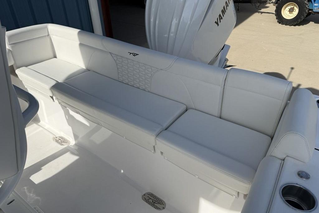 2026 Tidewater 232 LXF boat with white cushioned seating and Yamaha engine.