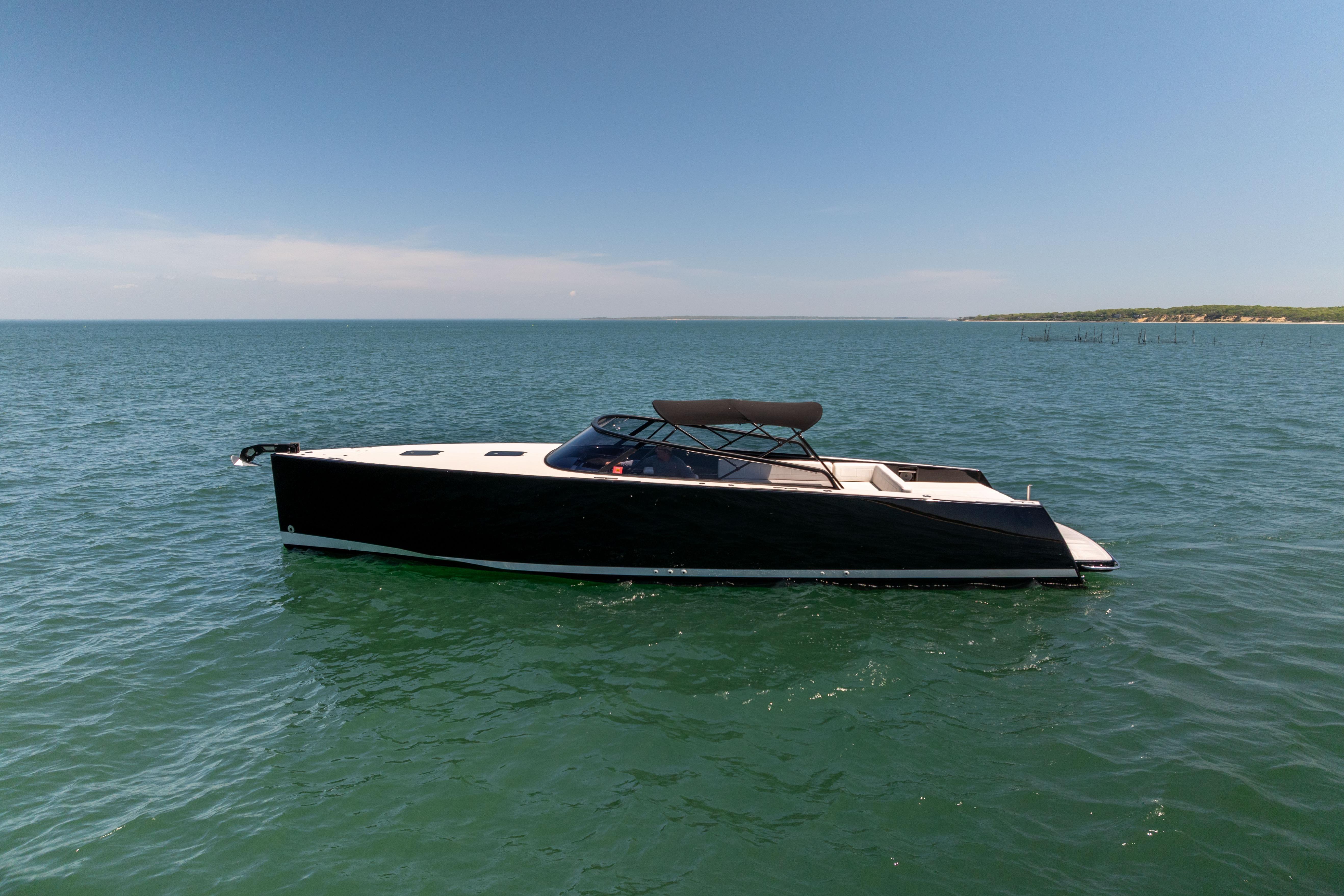 2016 VanDutch 40 yacht on open water under clear blue sky.