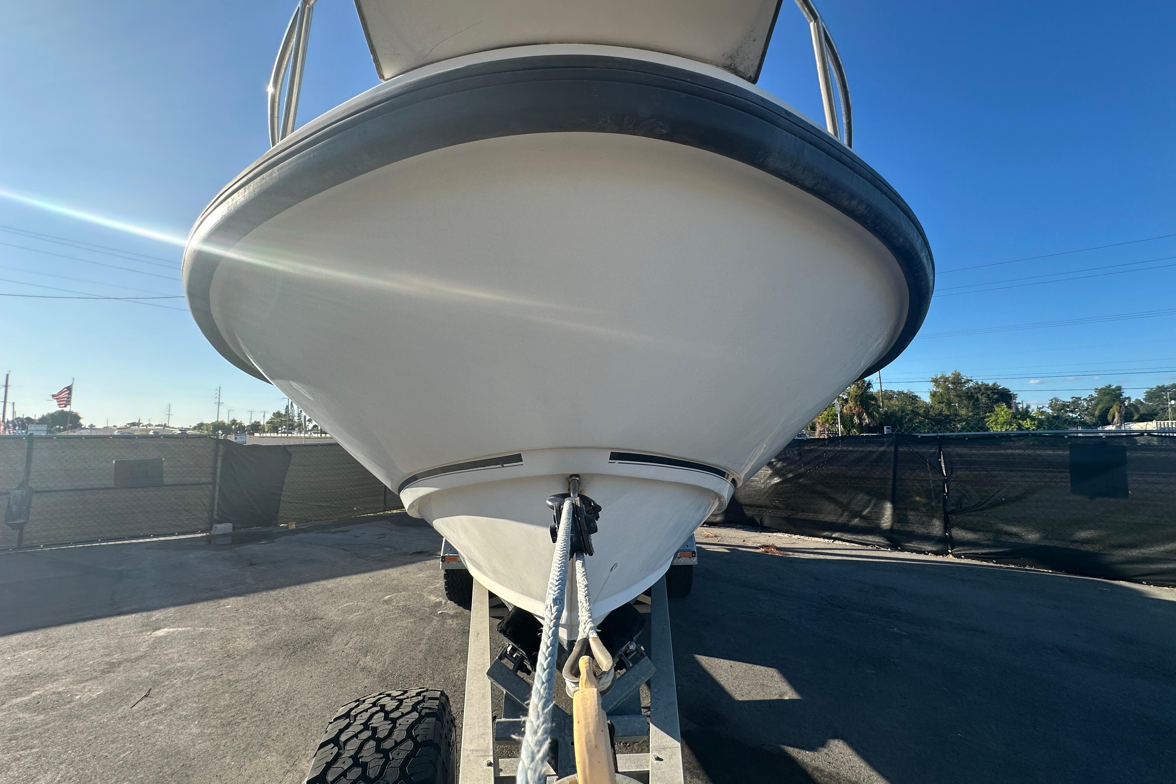 2001 Boston Whaler 23 Conquest boat on trailer, viewed from the front.