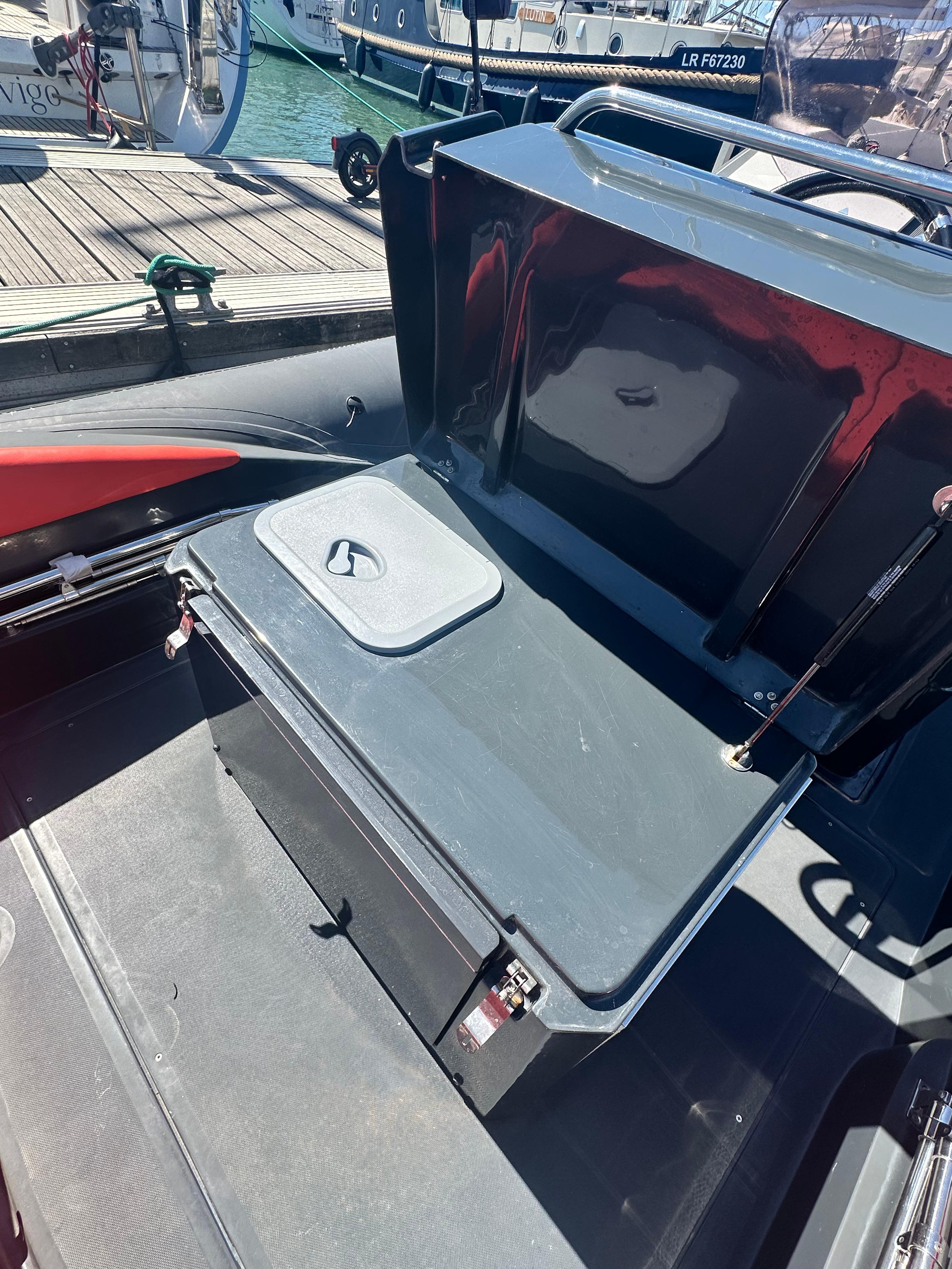 2014 Lomac Adrenalina 7.5 boat interior with open storage compartment.