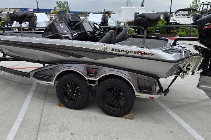 2025 Ranger Z518 boat on trailer, parked outdoors, showcasing sleek design and modern features.