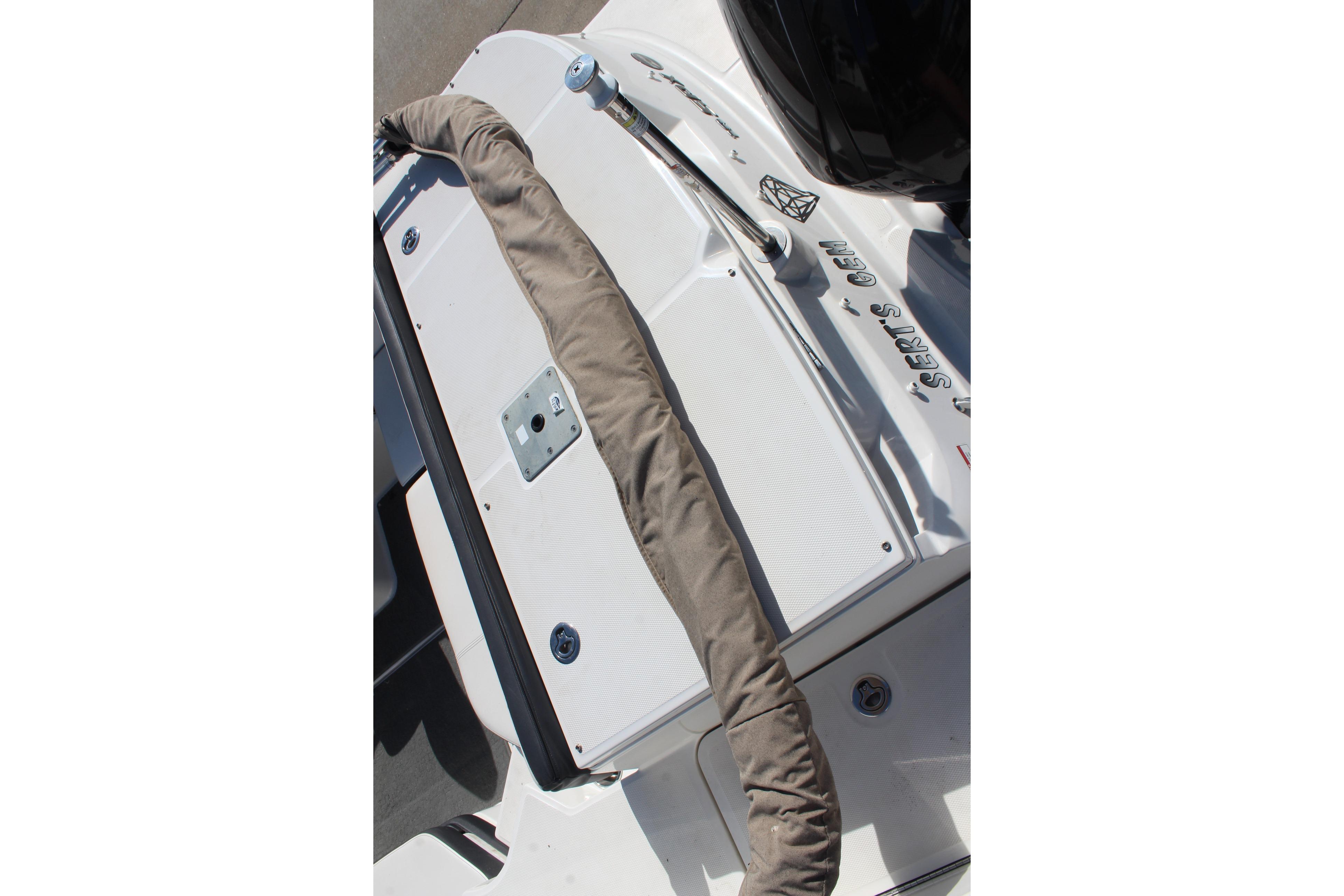 2015 Sea Ray 19 SPX OB boat deck with protective cover and fittings.