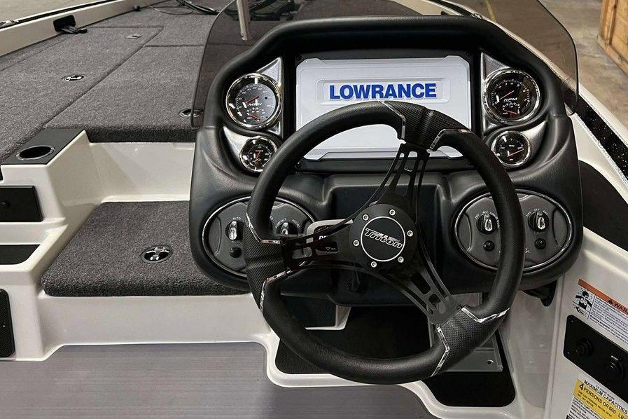 2026 Triton 18 TrX boat dashboard with Lowrance display and steering wheel.