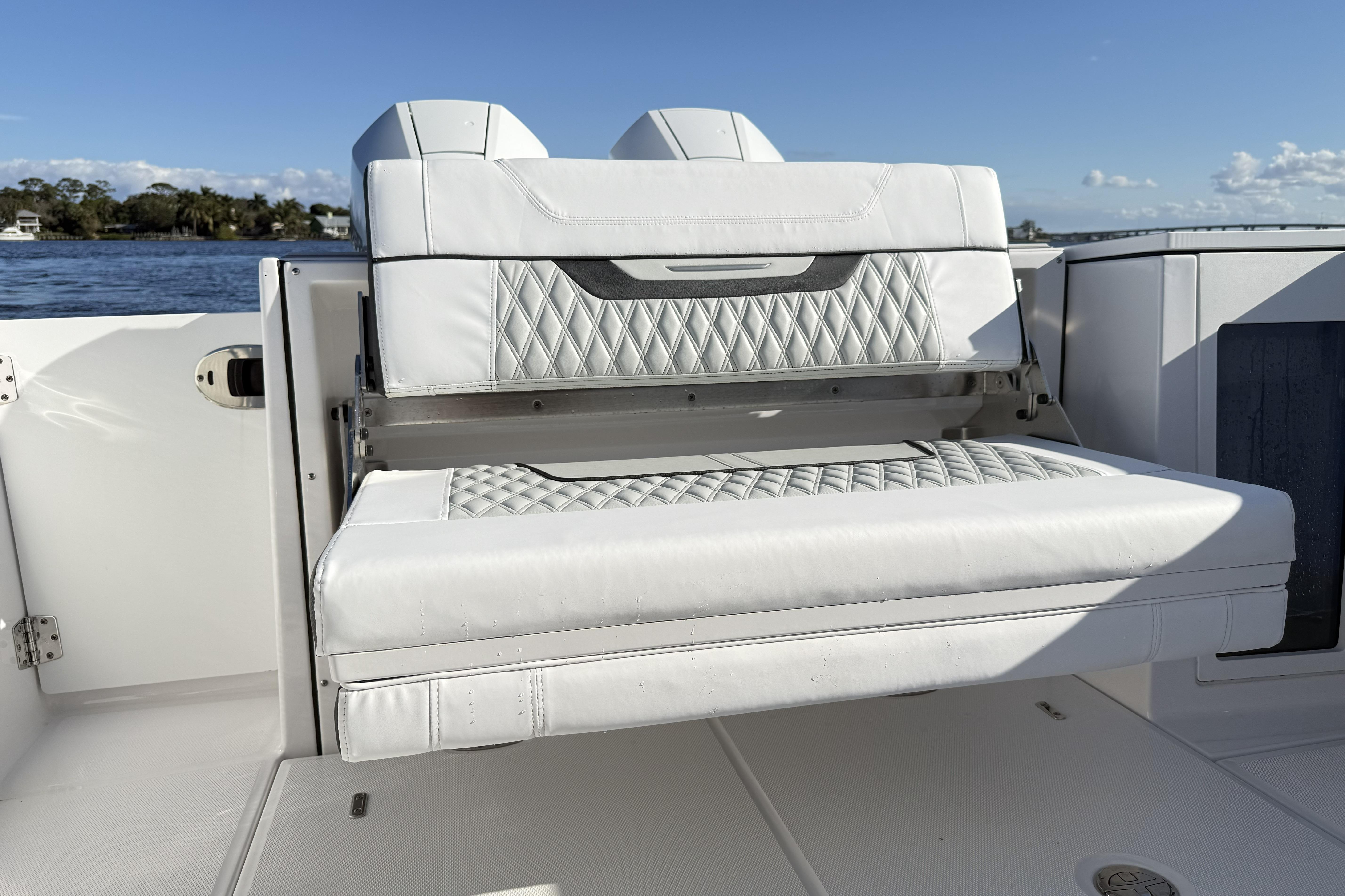 2025 Blackfin 272 DC boat with luxurious white seating and diamond stitching.