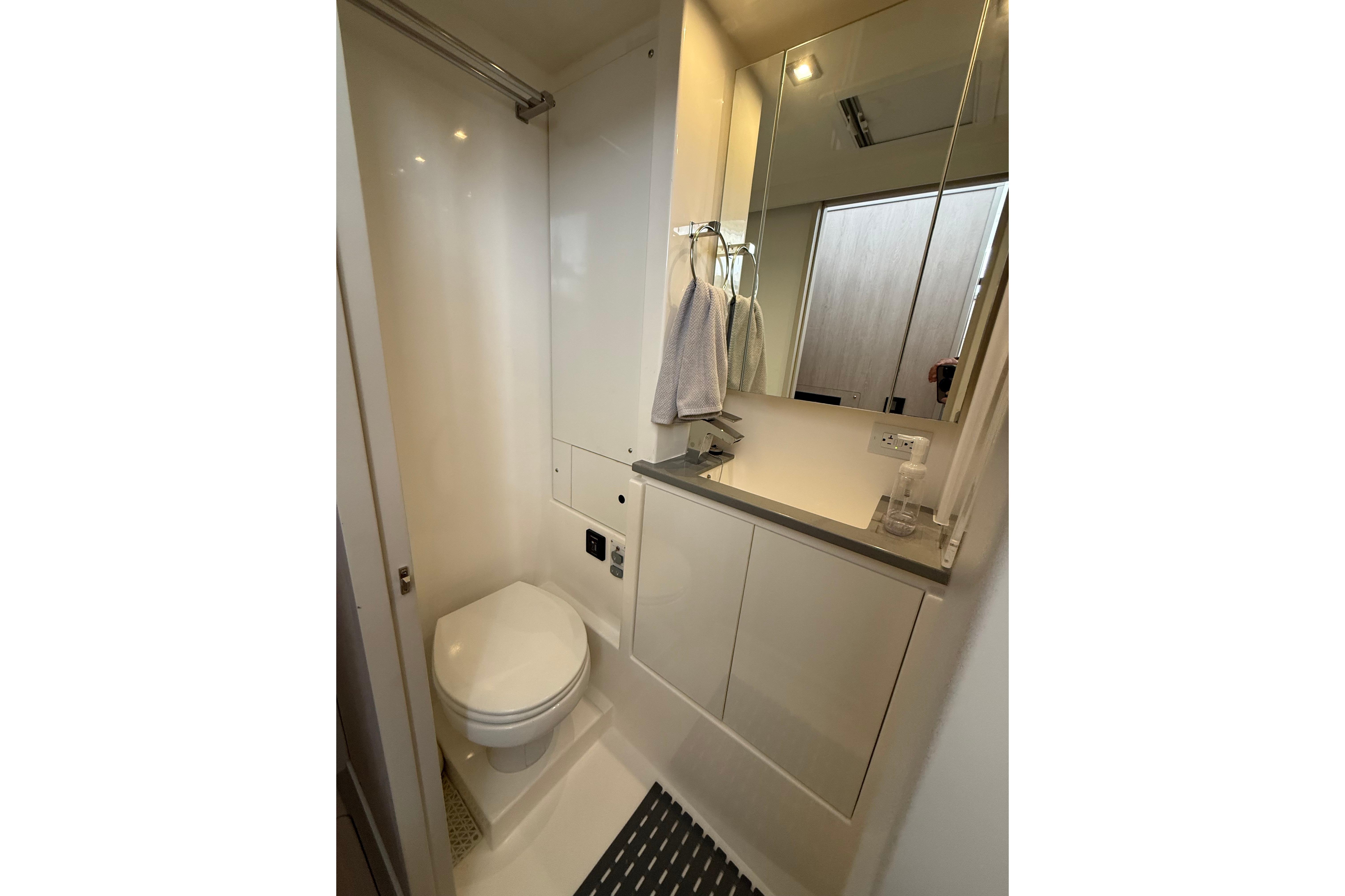 Modern bathroom in 2021 Leopard 43 Powercat, featuring sleek design and compact amenities.