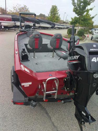2024 Ranger VS1665T boat with Mercury 40 engine, red exterior, parked outdoors.