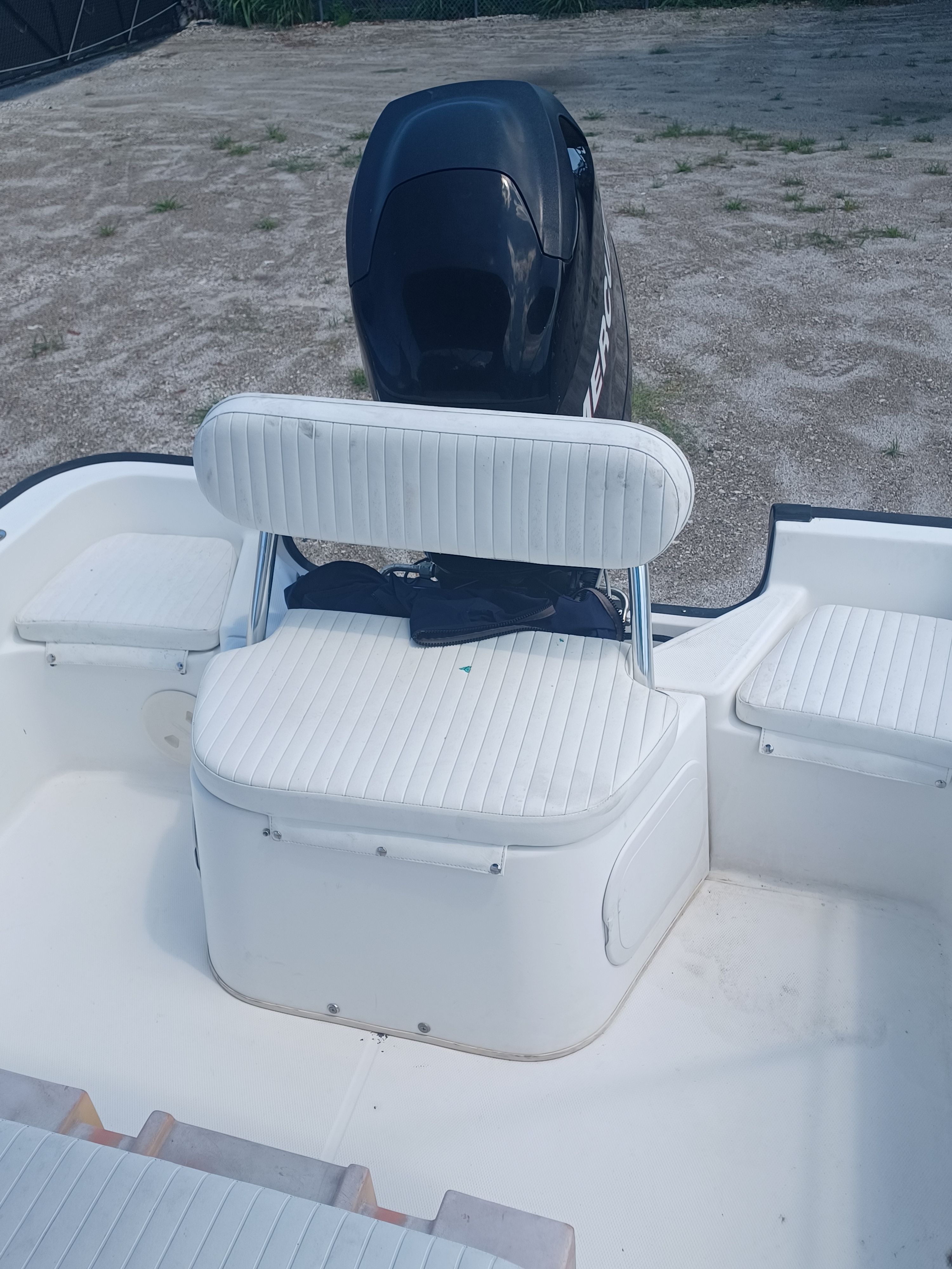 Rear view of a Boston Whaler 170 Montauk with an outboard motor.