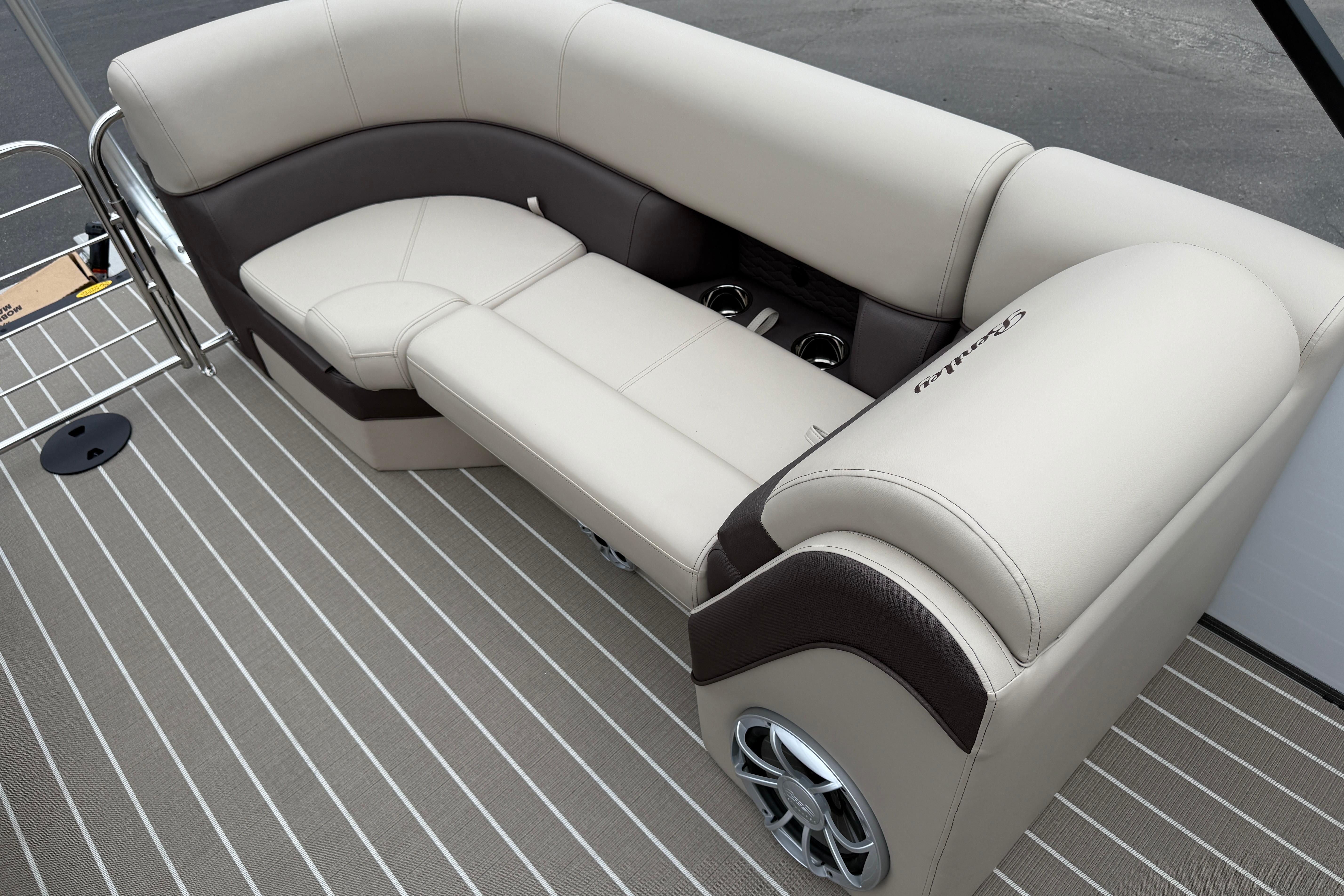 2026 Bentley Pontoons Elite 253 Admiral interior seating with luxurious beige upholstery.