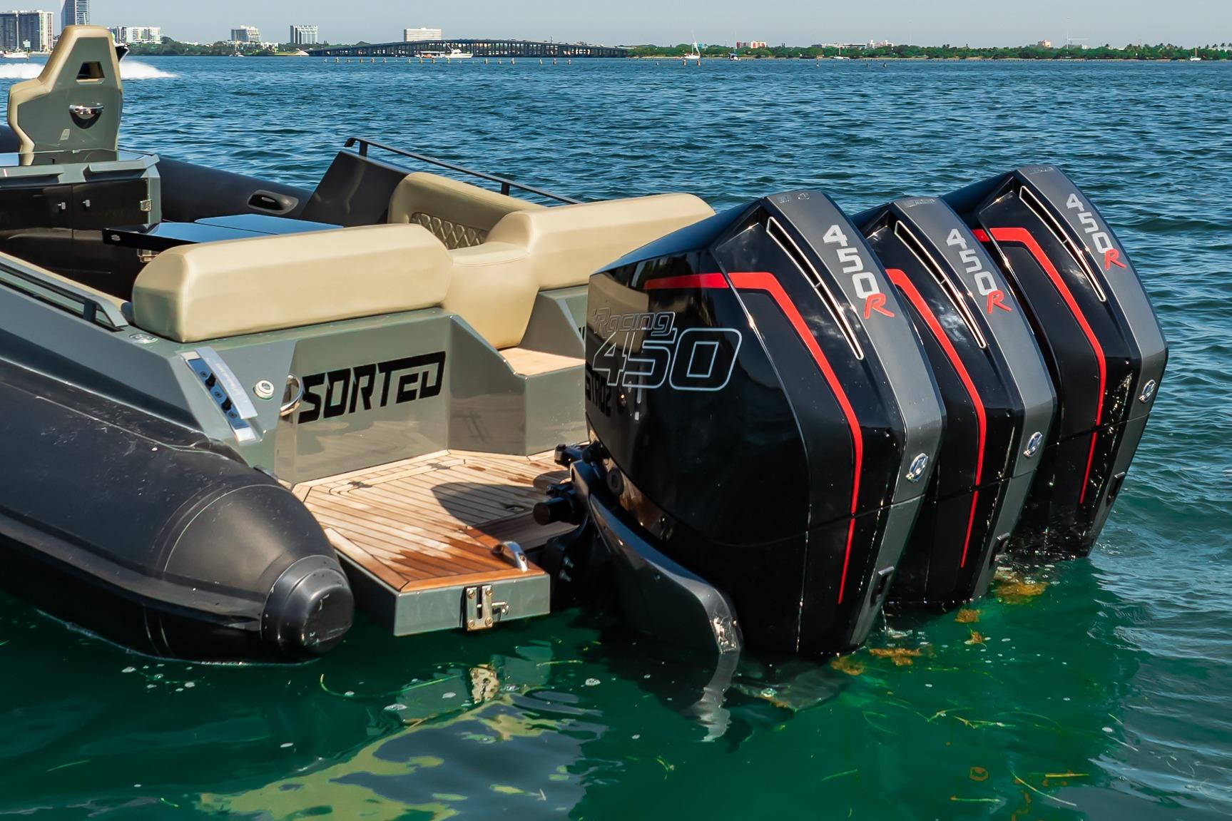 2023 Skipper-BSK 38NC boat with triple 450R engines on clear water.