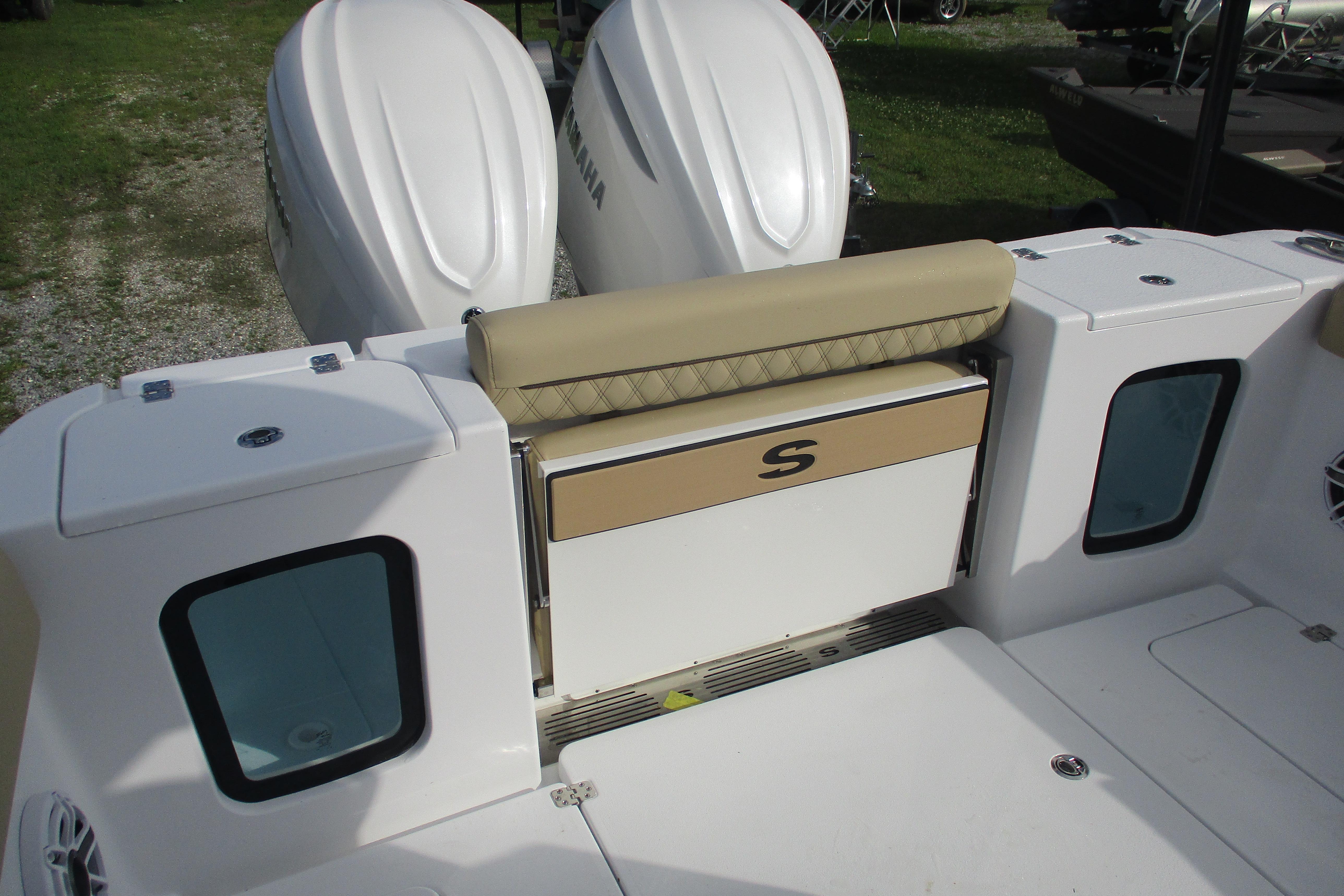 2026 Sportsman Open 302 Center Console boat with dual Yamaha engines and cushioned seating.