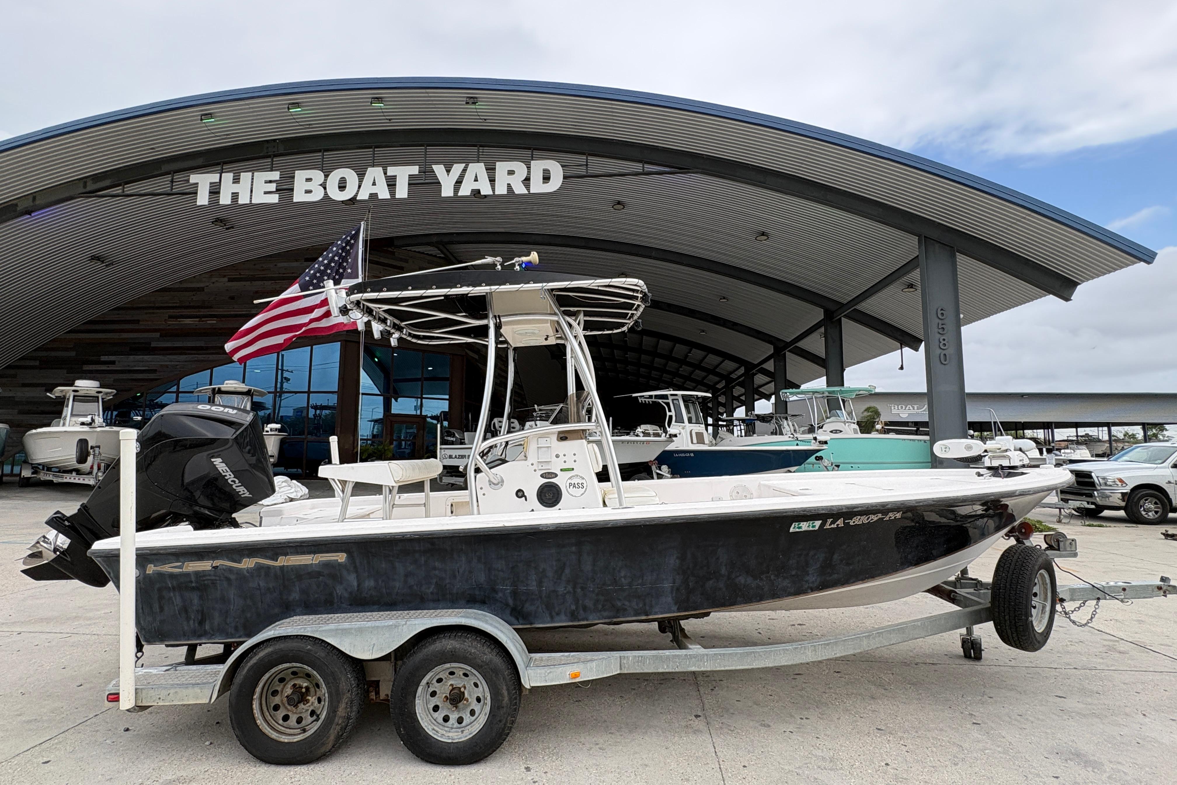 Kenner 21 VISION boat from 2000 on trailer at The Boat Yard dealership.
