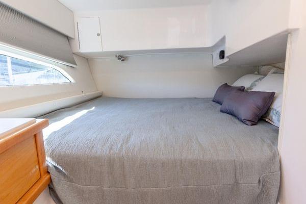 2023 Intrepid 438 Evolution cabin with cozy bed and modern design.