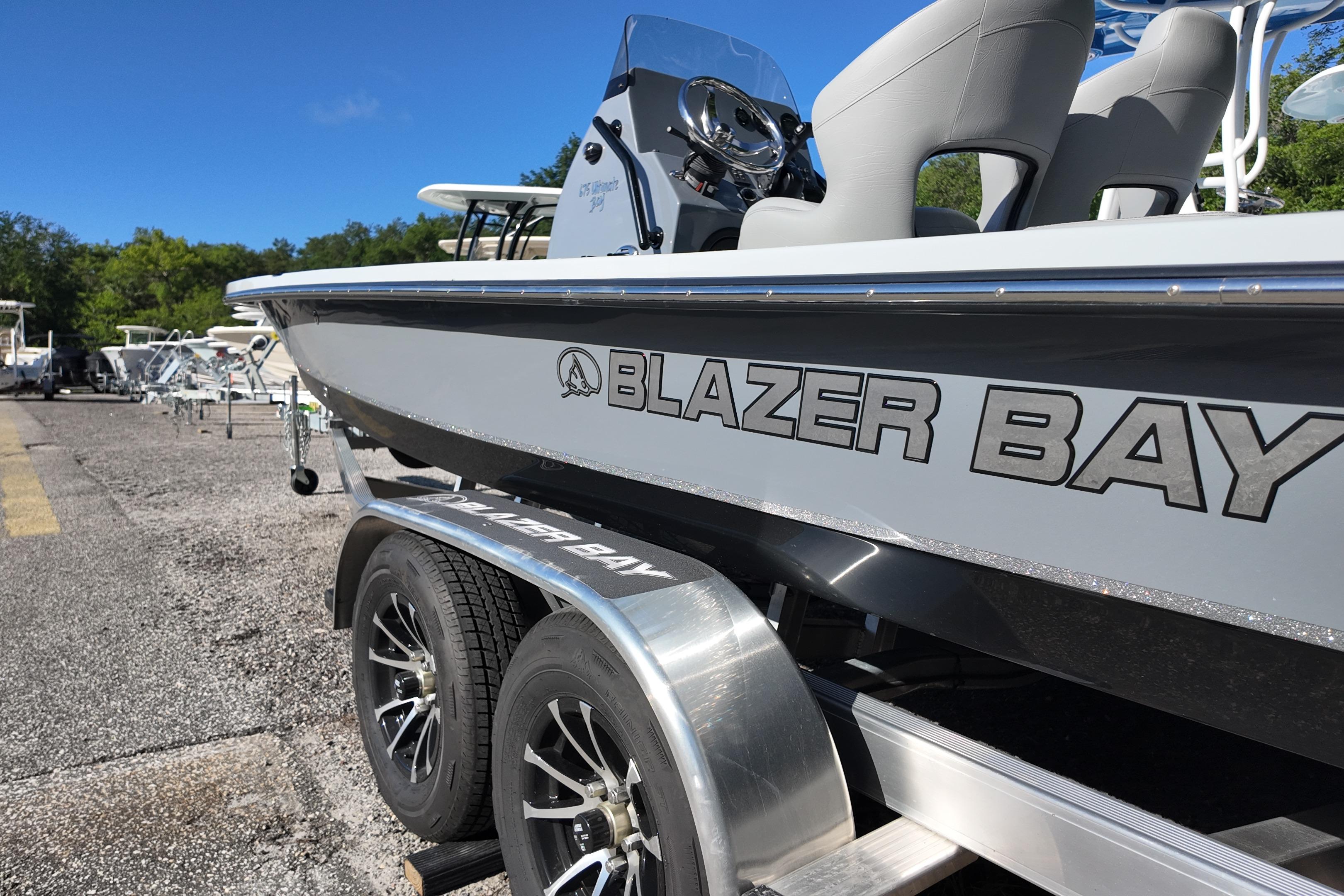 2026 Blazer Bay 675 Ultimate Bay boat on trailer, side view.