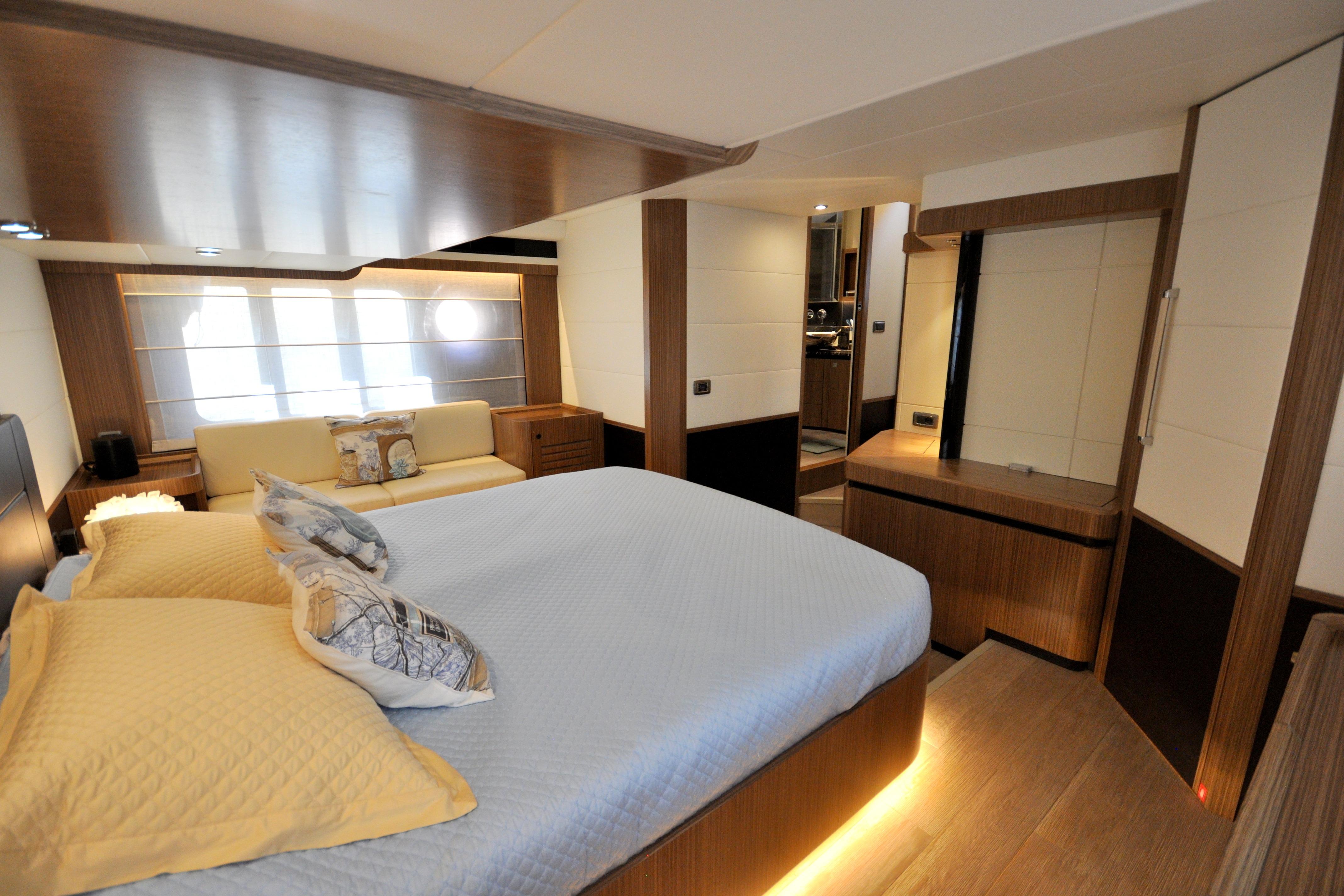 Luxurious 2018 Absolute Navetta 52 yacht bedroom with modern design and elegant furnishings.