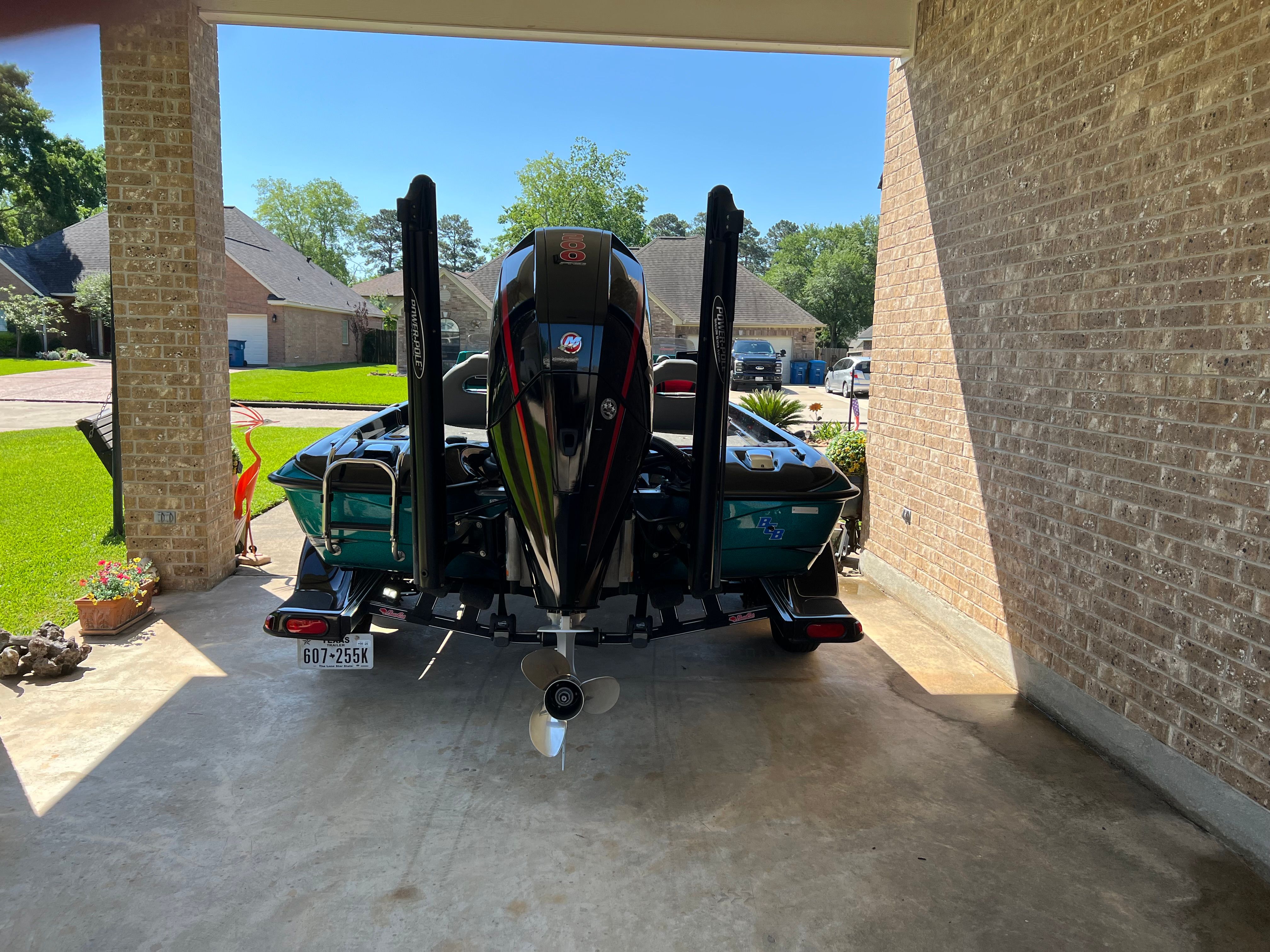 A 2020 Bass Cat Pantera II boat is parked in a garage.