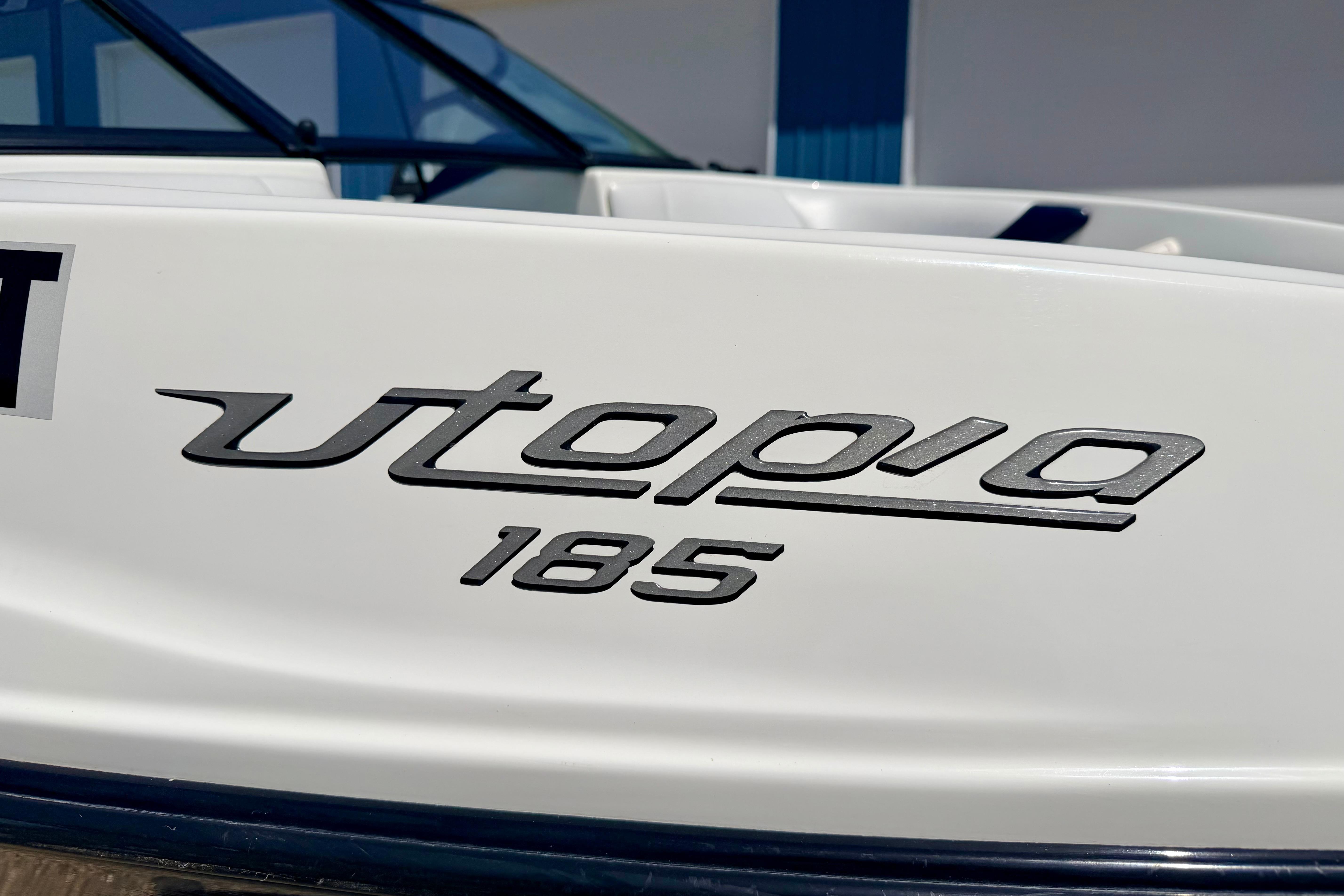 2004 Bombardier SEADOO Utopia 185 boat logo on white surface.