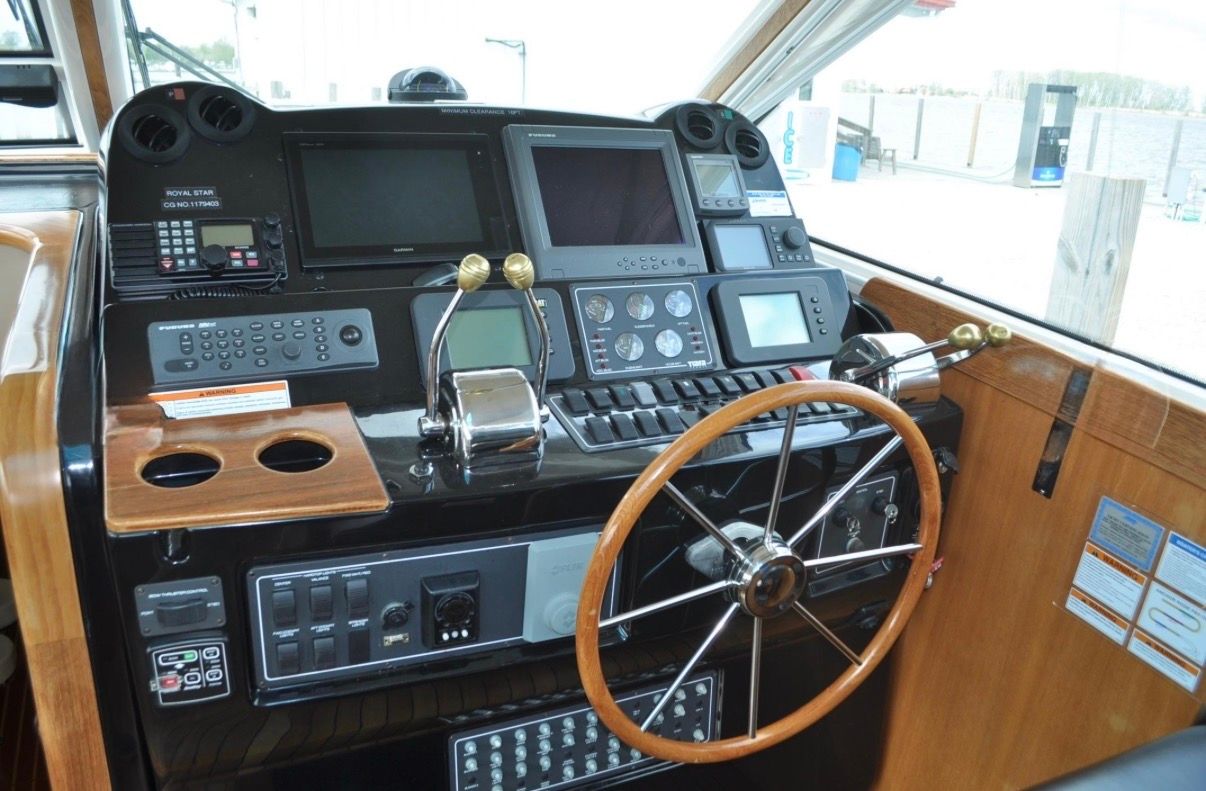 Helm of the 2005 Tiara Yachts 5200 Sovran with modern navigation equipment.