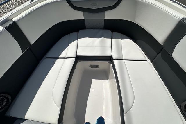 Interior seating of 2023 Chaparral 270 OSX boat, featuring sleek, cushioned design.