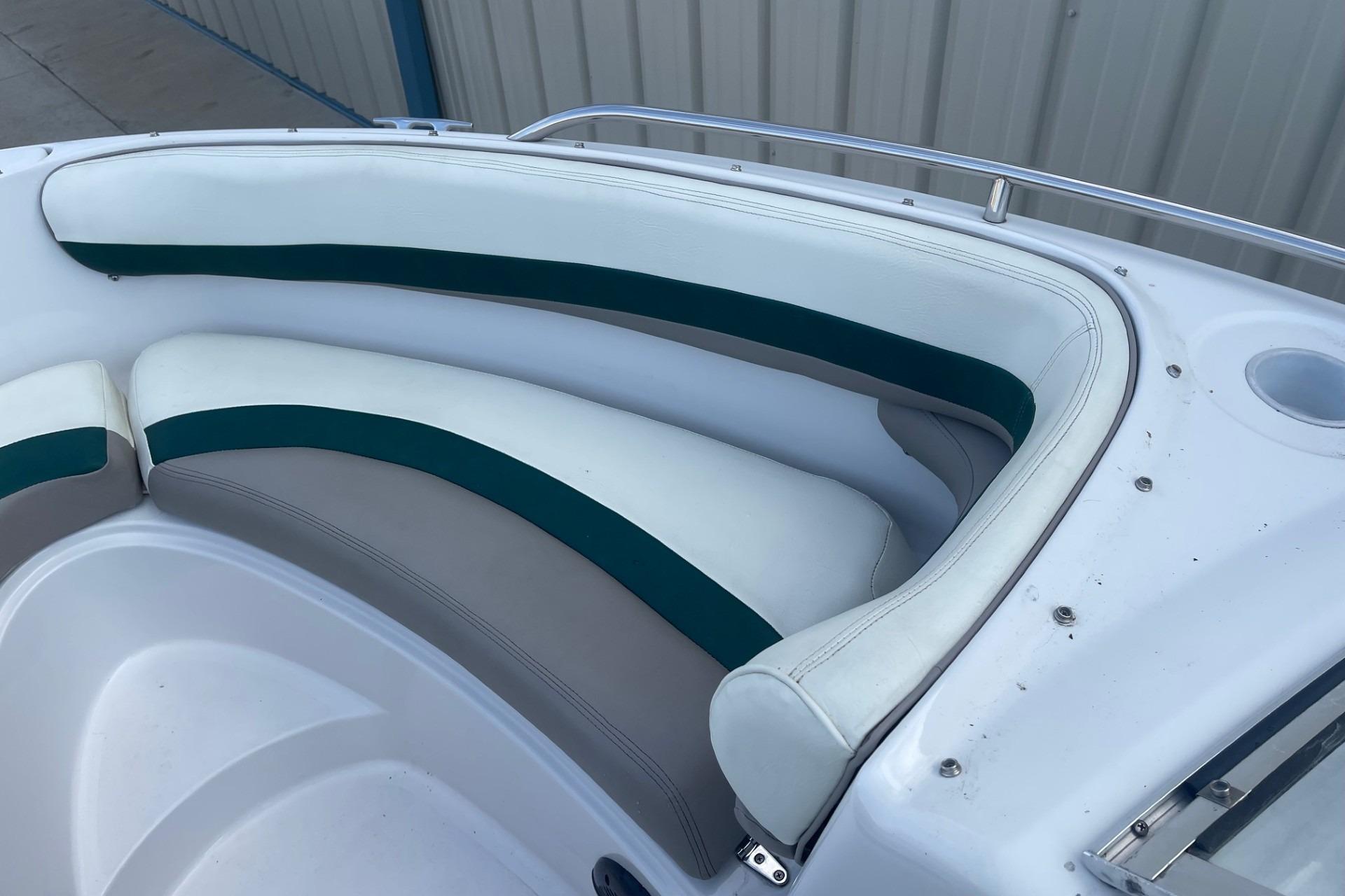 1996 Four Winns 200 Horizon boat interior with white and green seating.
