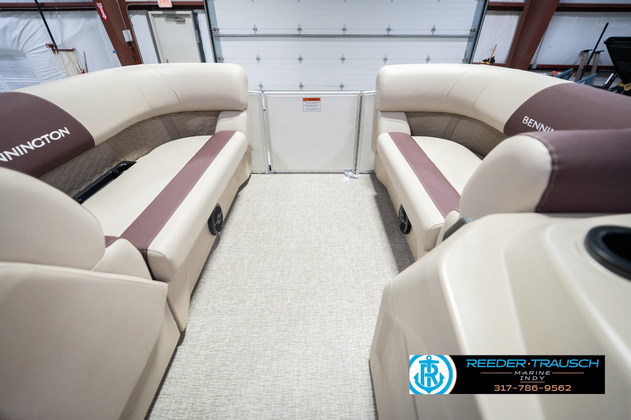 Interior of 2026 Bennington 188 SLJ pontoon boat with beige and brown seating.