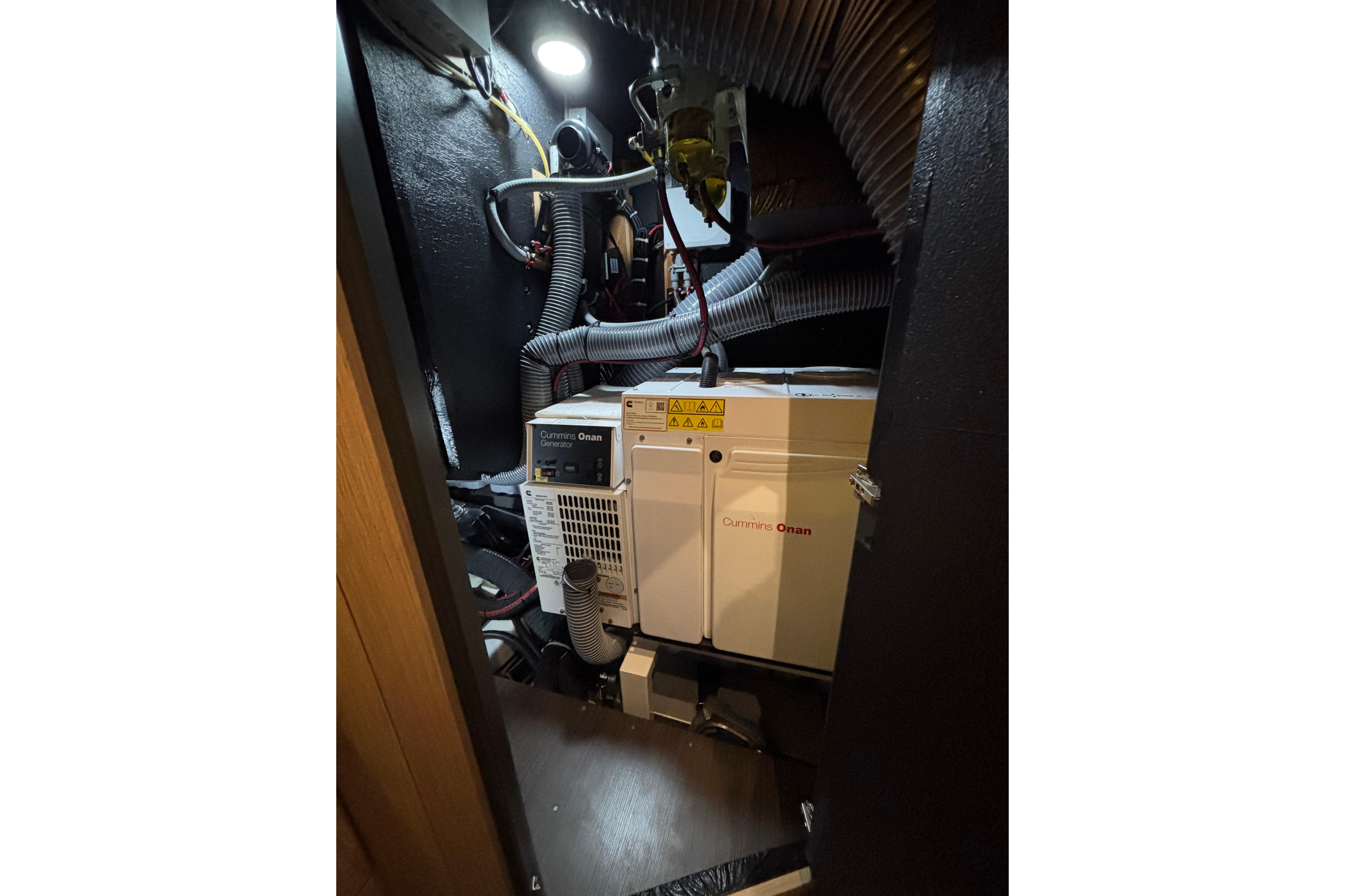 Engine room of 2018 Beneteau Oceanis Yacht 62 with Cummins Onan generator.