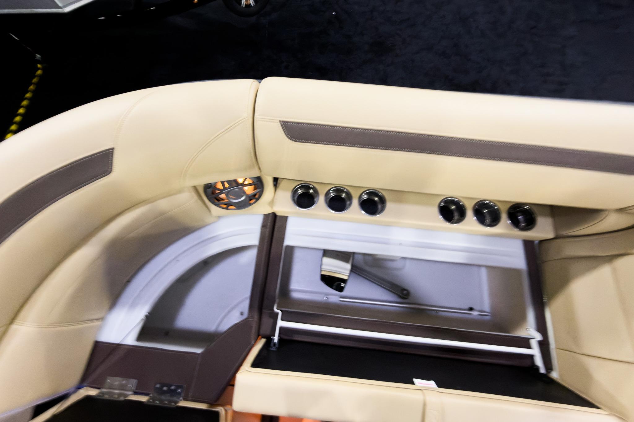 Interior of 2026 Montara Surf Boss EVO SLDH 25' with beige seating and control panel.