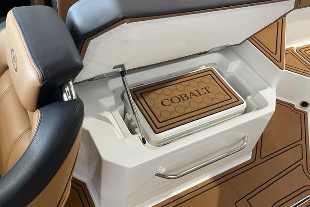 2023 Cobalt R6 Surf boat interior with built-in cooler and stylish seating.