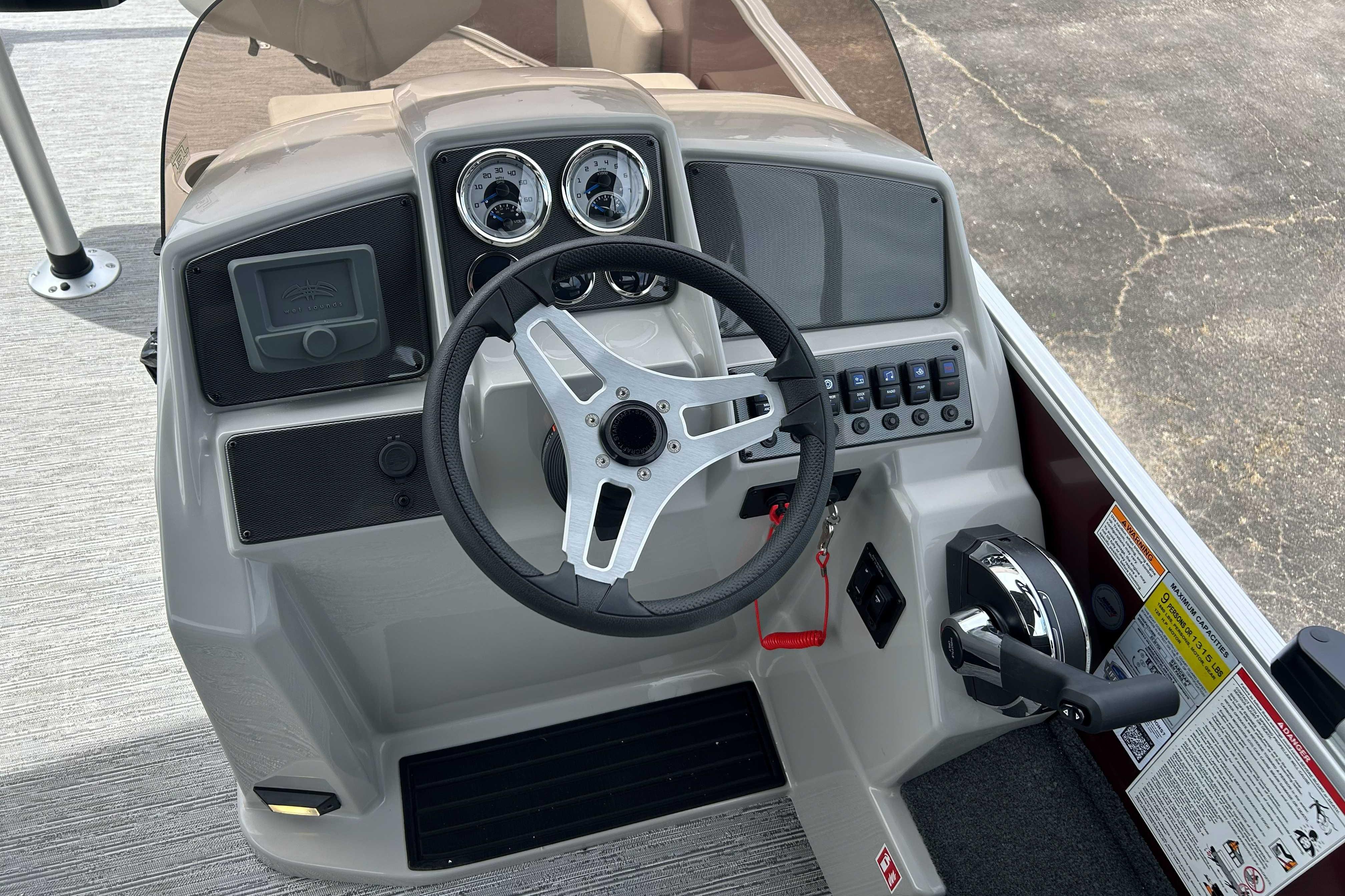 Steering console of 2026 Starcraft EX 20 F boat with gauges and controls.