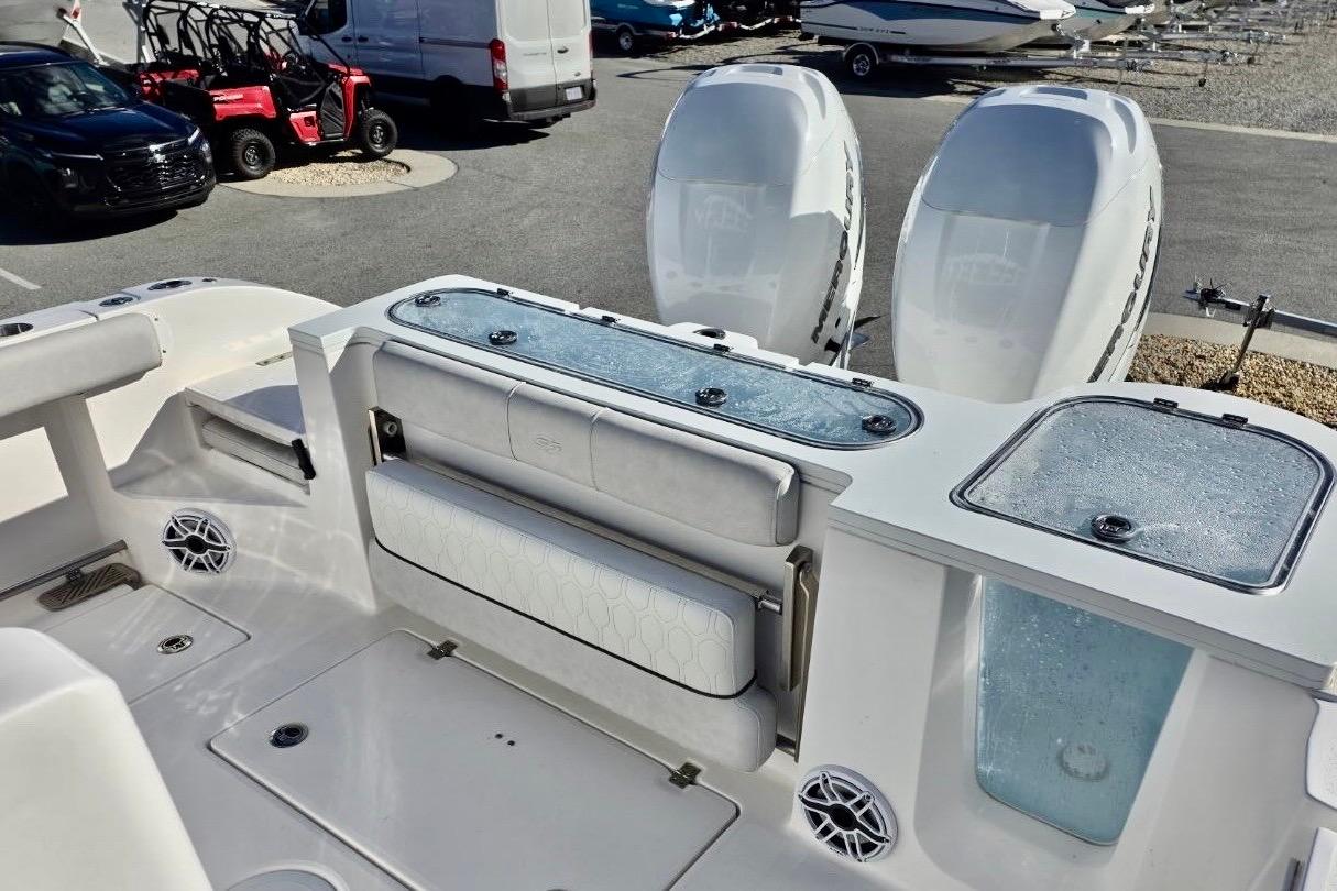 2023 Sea Fox 328 Commander boat interior with dual engines and seating area.