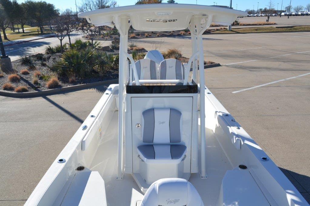 2025 Ranger 2360 Bay boat with sleek design and spacious seating in a parking lot.