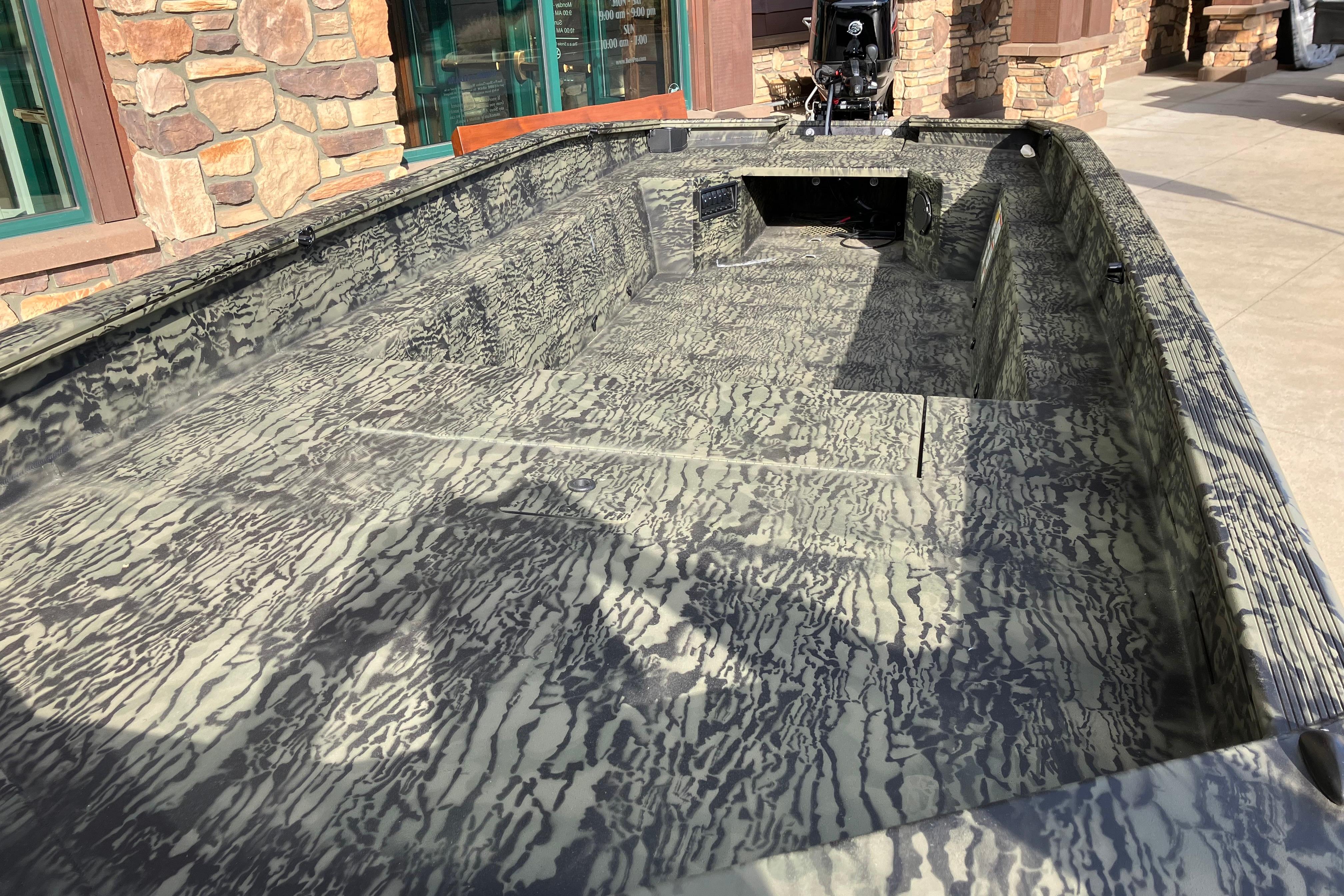 2026 Tracker Grizzly 1650 T Prairie Wings Edition boat with camouflage interior design.