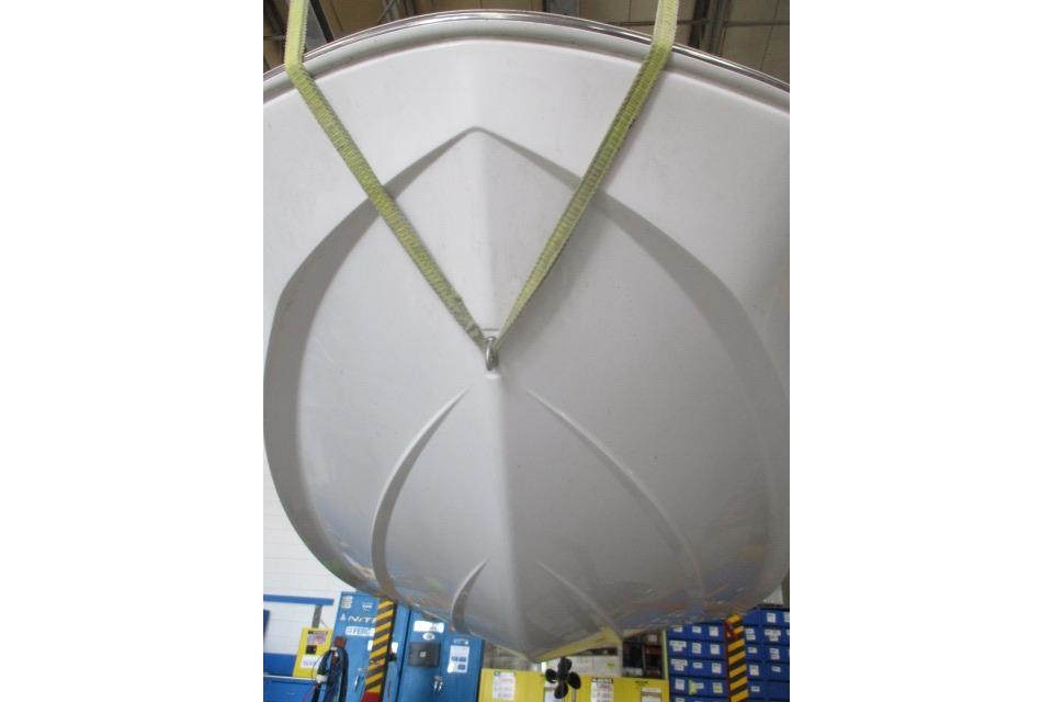 2024 Tahoe T16 boat hull suspended in a workshop setting.
