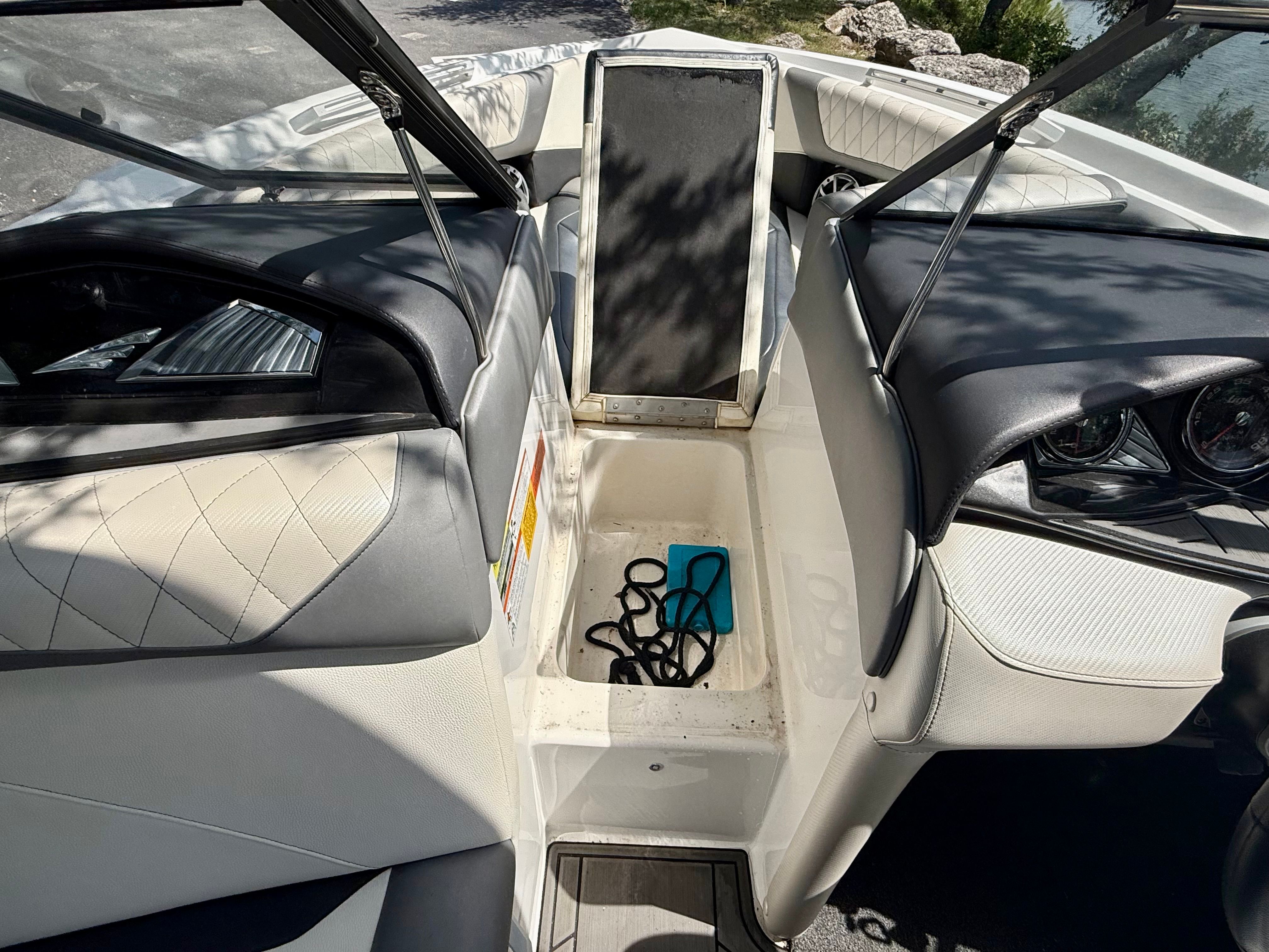 The image shows the interior of a 2017 Tigé Z3 boat with seating and storage space.