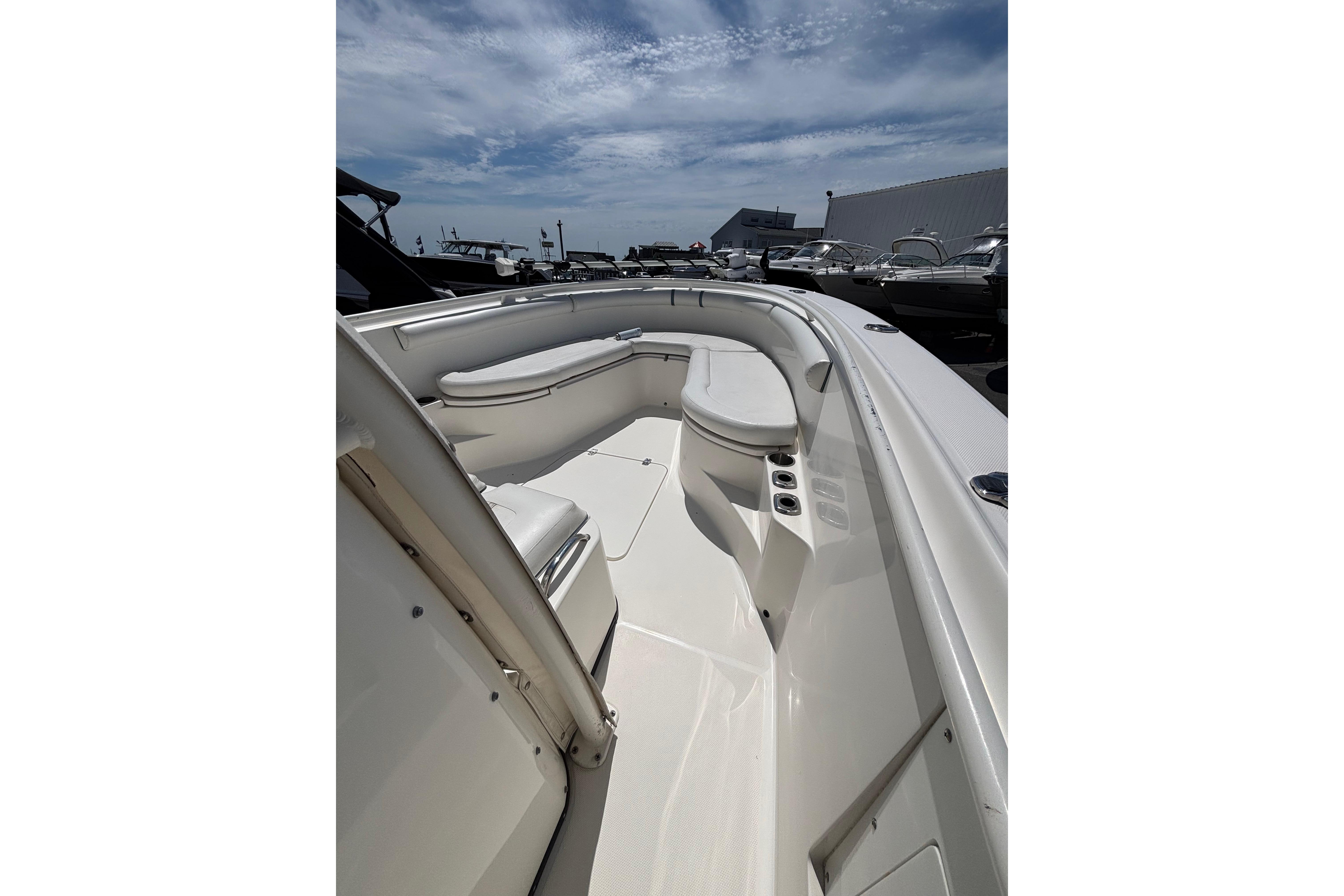 2006 Edgewater 318CC boat interior with seating, under a partly cloudy sky.