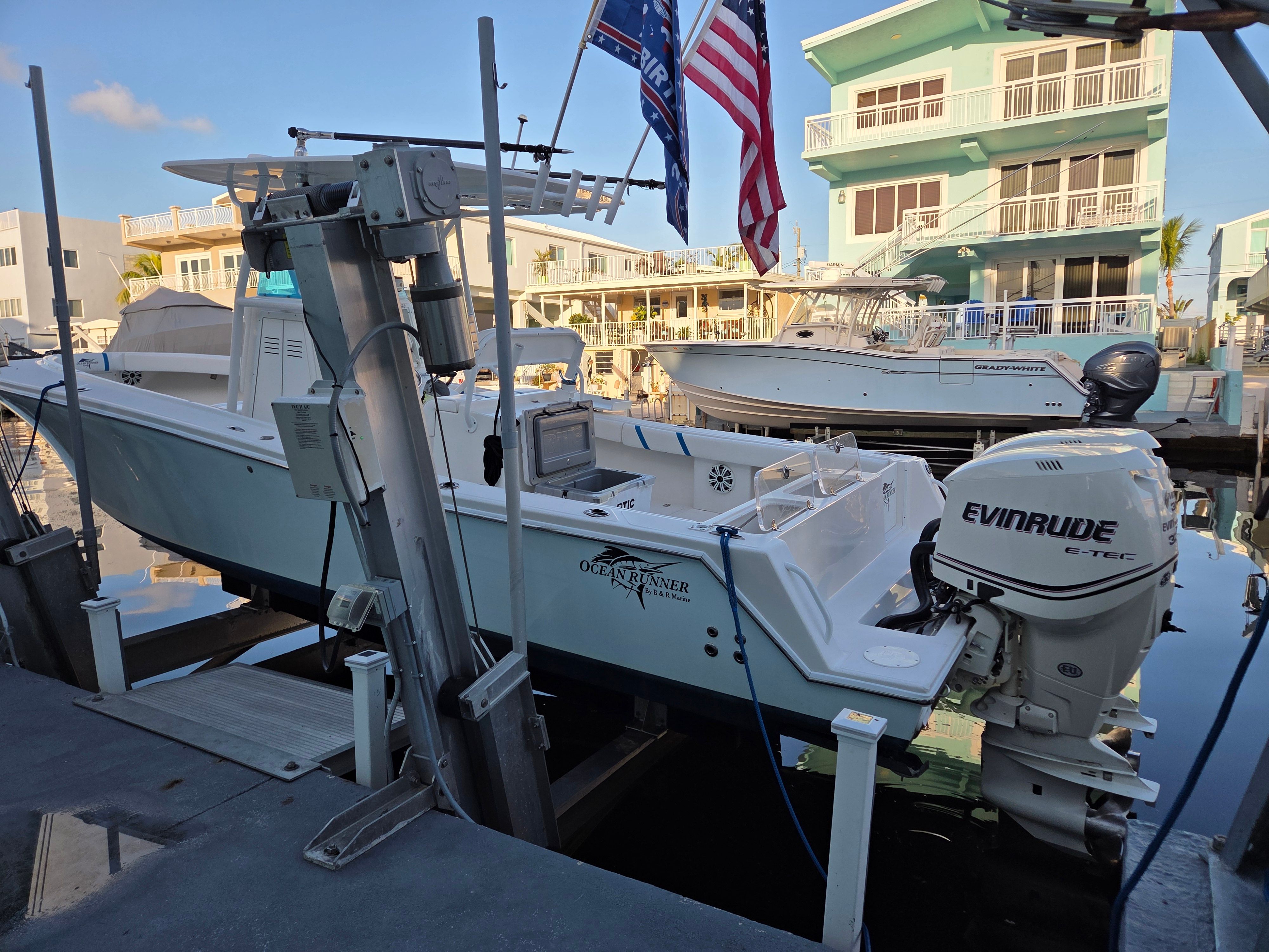 2012 Ocean Runner 29 boat docked with Evinrude engine.