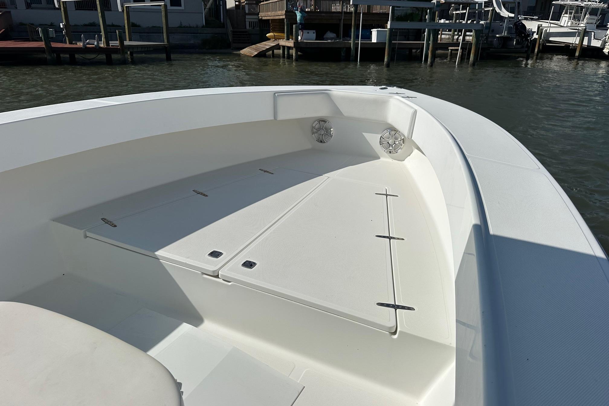 2003 Venture 34 Center Console boat, spacious deck, docked at marina.