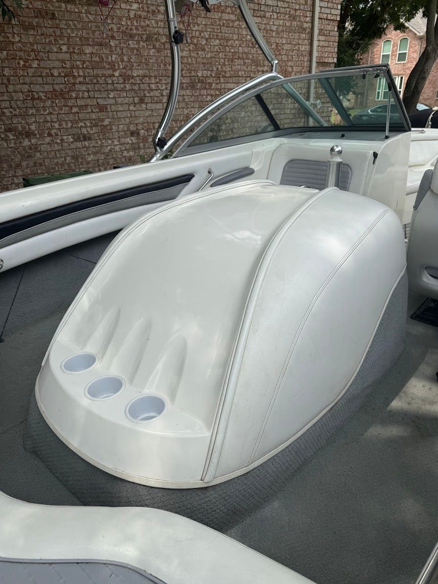 The image shows the interior of a 1999 MasterCraft Prostar 205 with white upholstery.