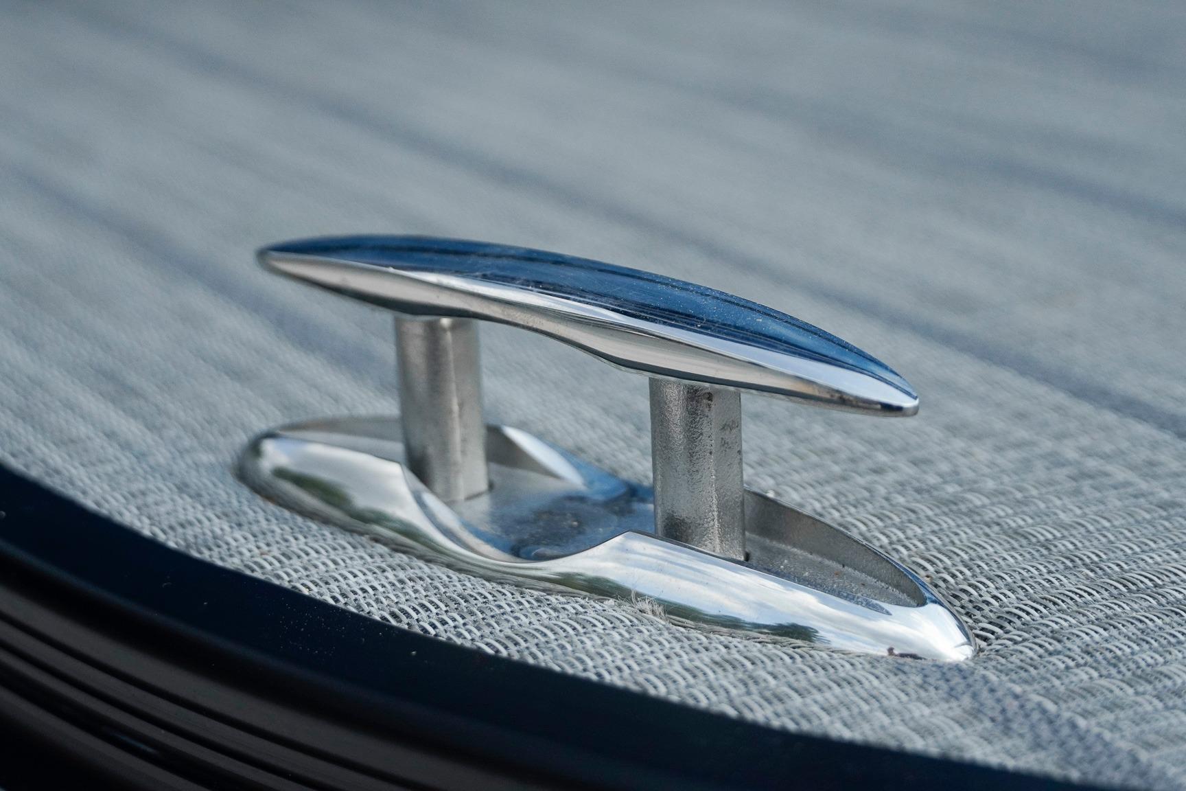 Close-up of a cleat on a 2025 SunCatcher Fusion 324RCX boat deck.