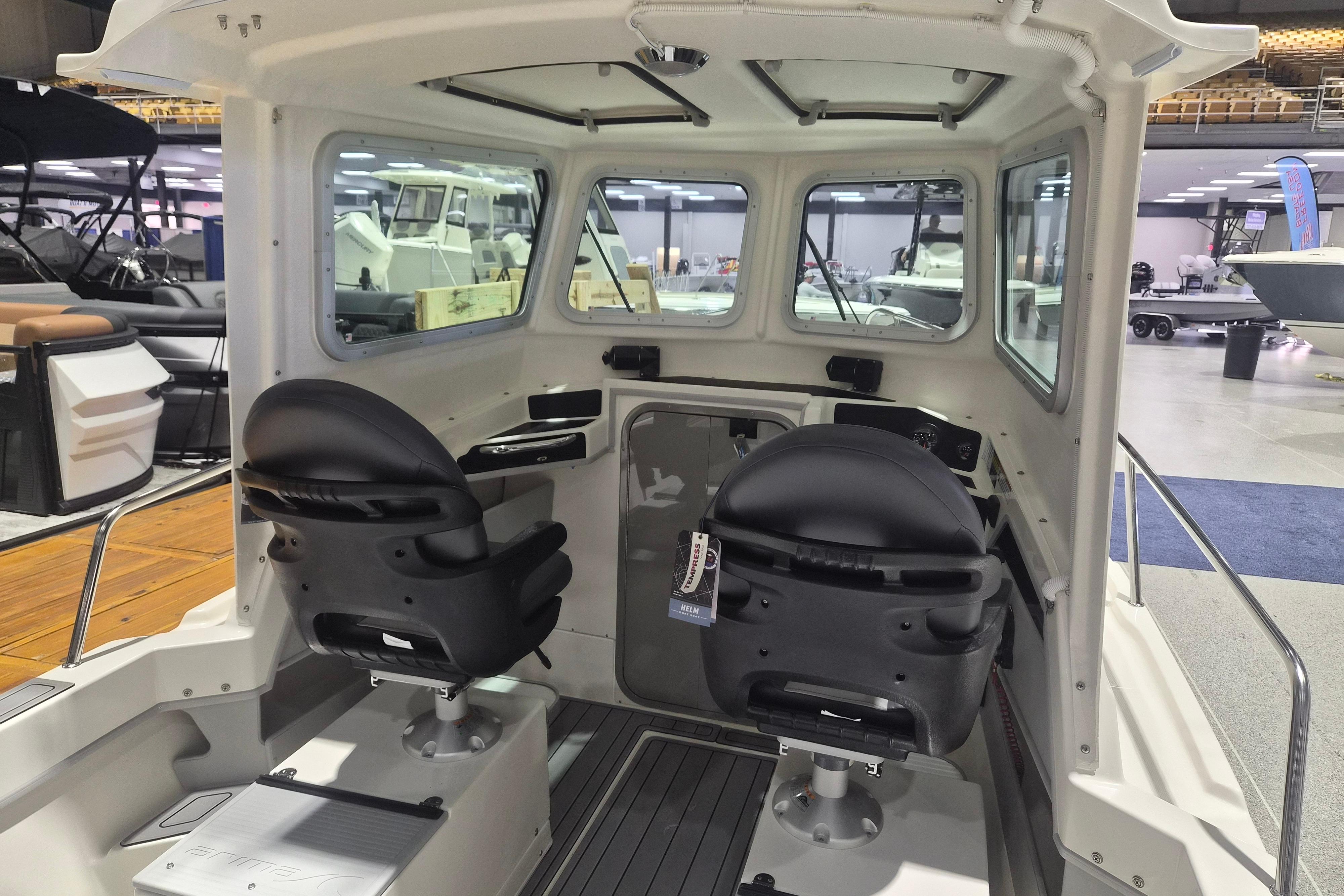 Interior of 2026 Arima Sea Chaser 19 Yellowtail Edition boat with dual black seats.