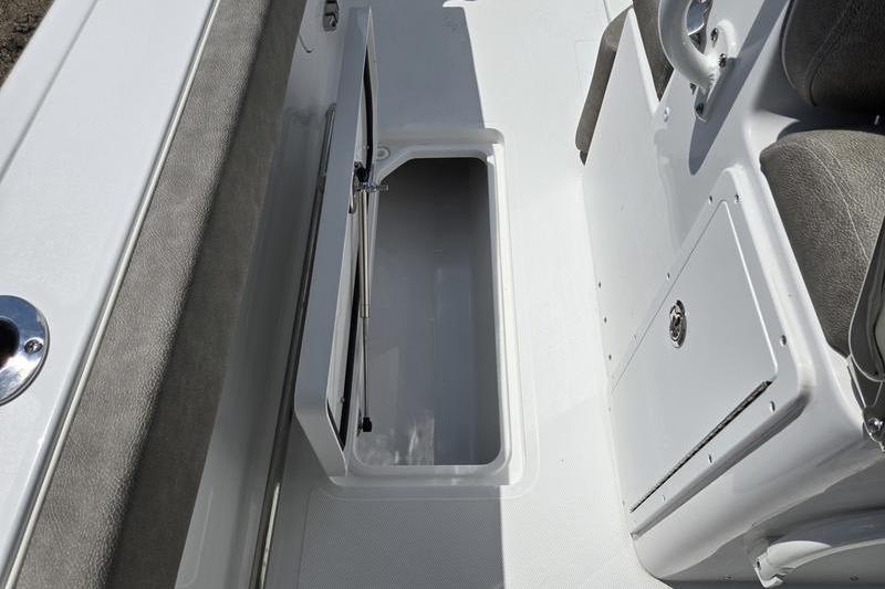 2027 Sea Hunt Ultra 275 SE boat storage compartment with open hatch, showcasing interior space.