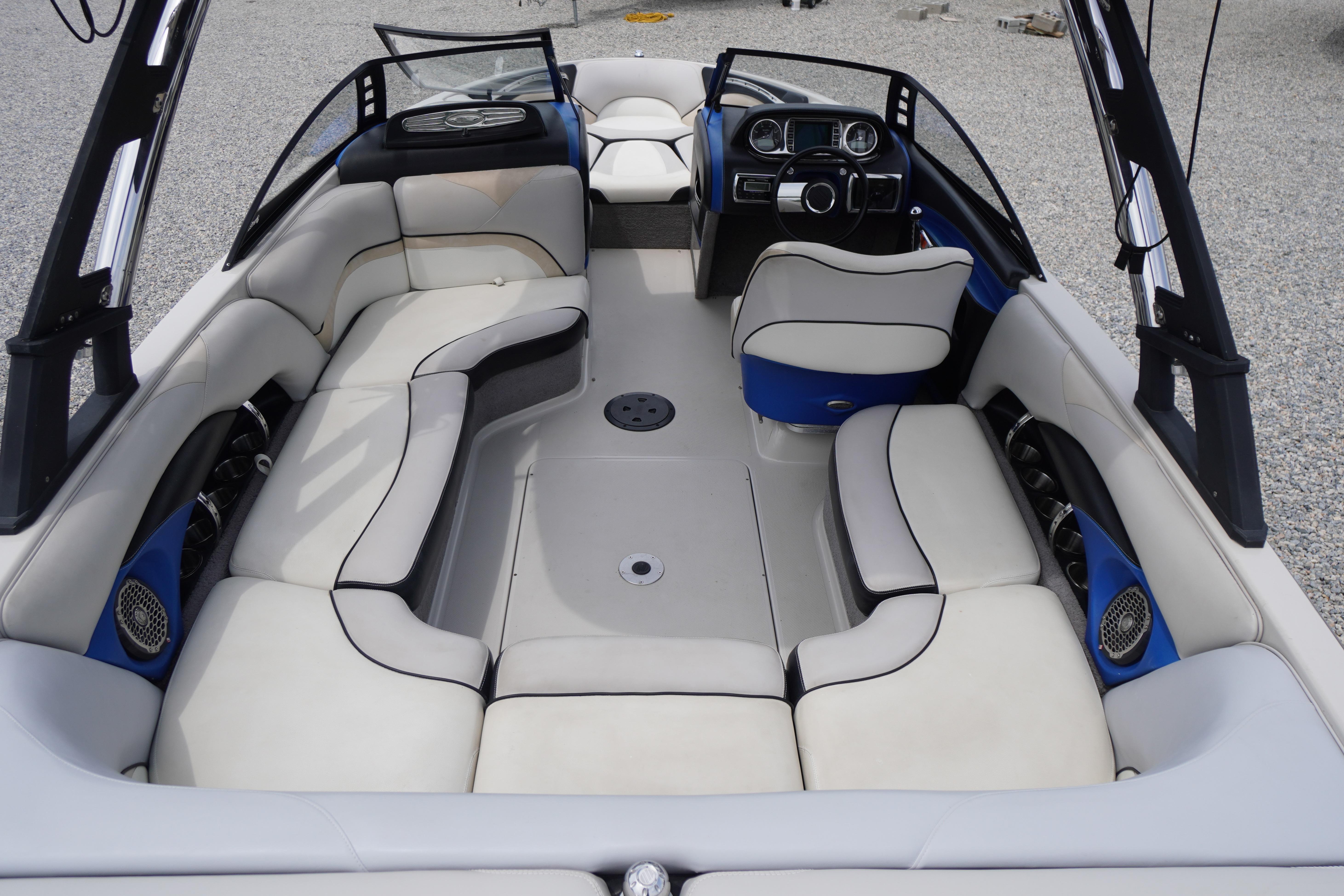 2011 Malibu Wakesetter 21 VLX boat interior with spacious seating and modern dashboard.