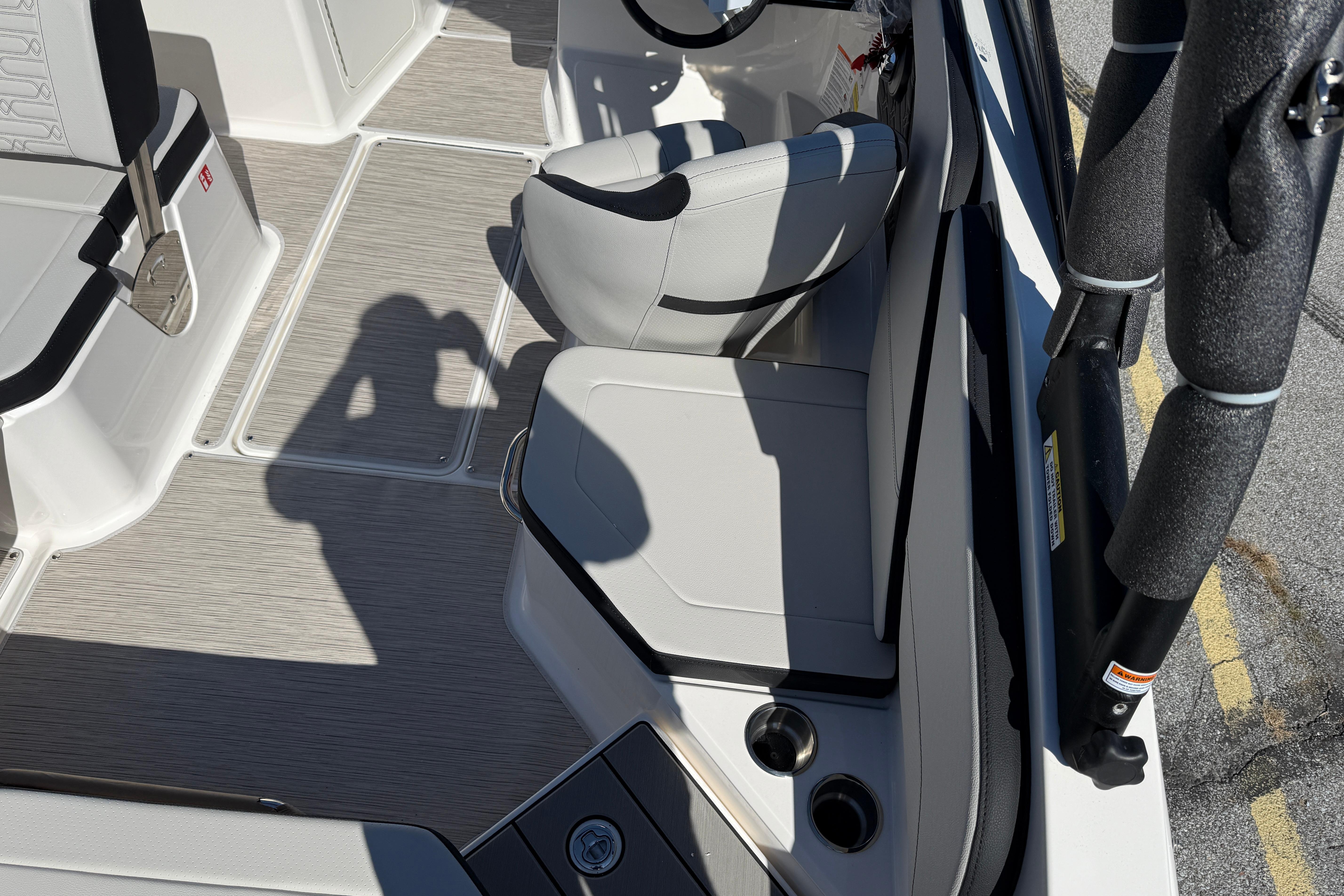 Interior of 2026 Sea Ray SPX 210 boat with seating and cup holders.