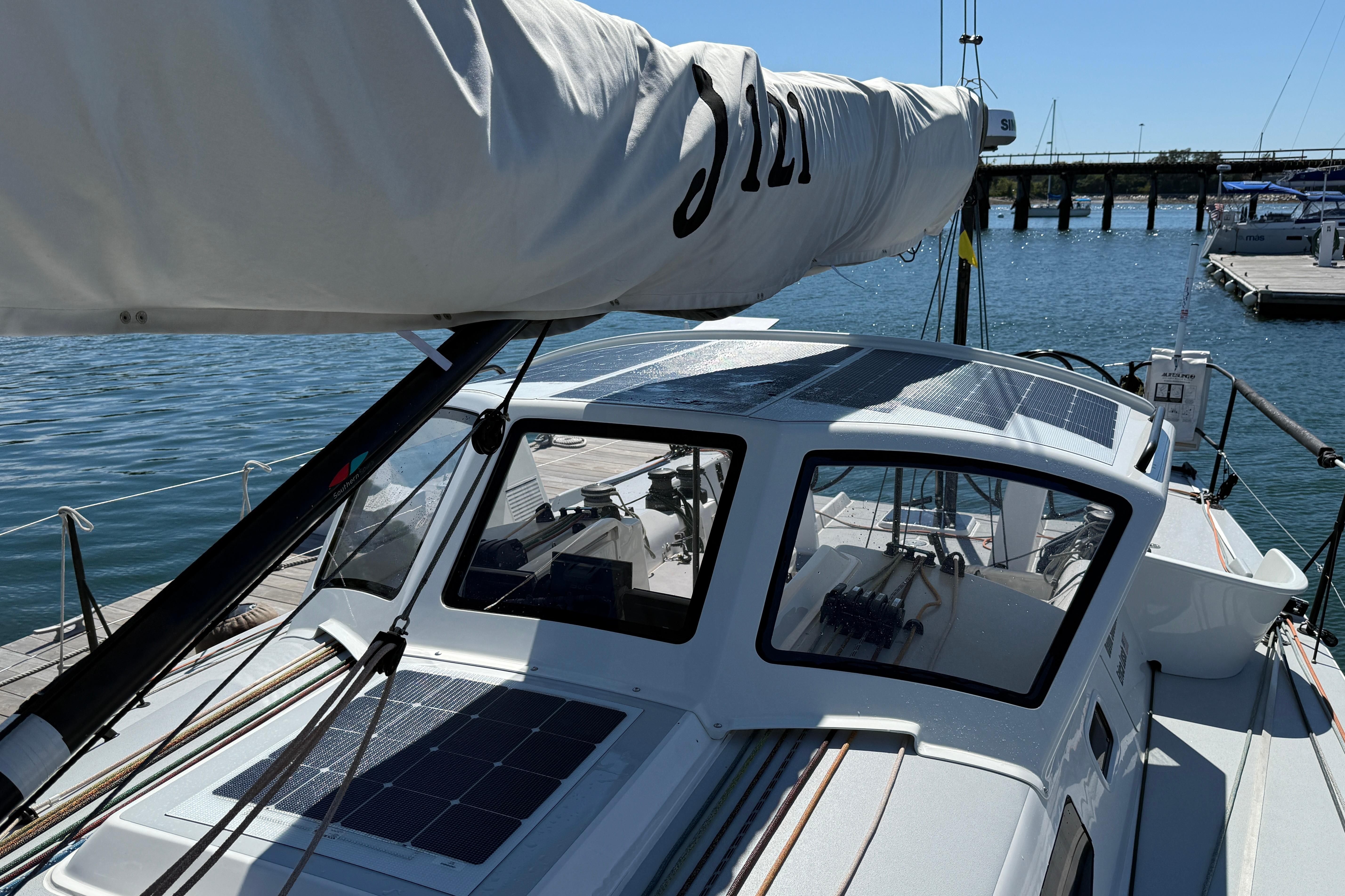 2018 J Boats J/121 sailboat docked, featuring sleek design and solar panels.