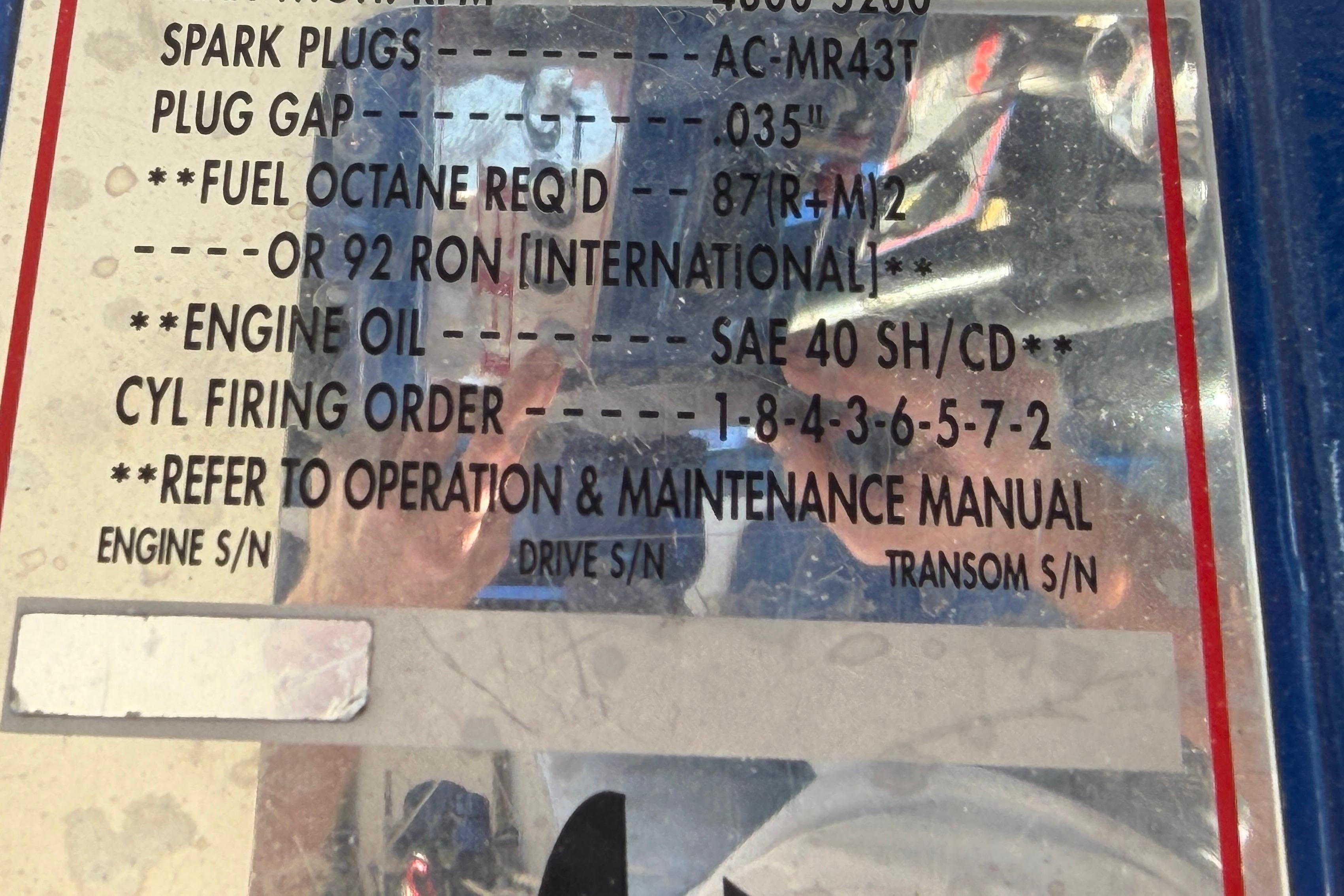 Instruction label for 2002 Cigarette 35' Cafe Racer, detailing engine specifications and maintenance.