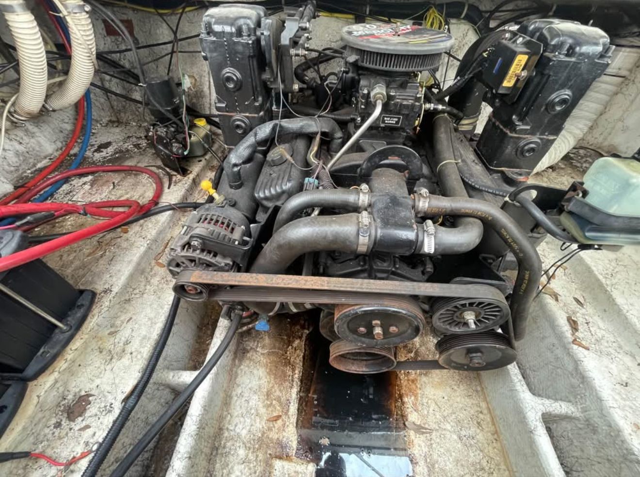 Engine compartment of a 2003 Bayliner 2452 Classic Cruiser boat.