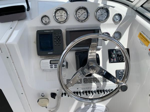2008 Sea Fox 236WA Pro Series boat dashboard with steering wheel and navigation instruments.