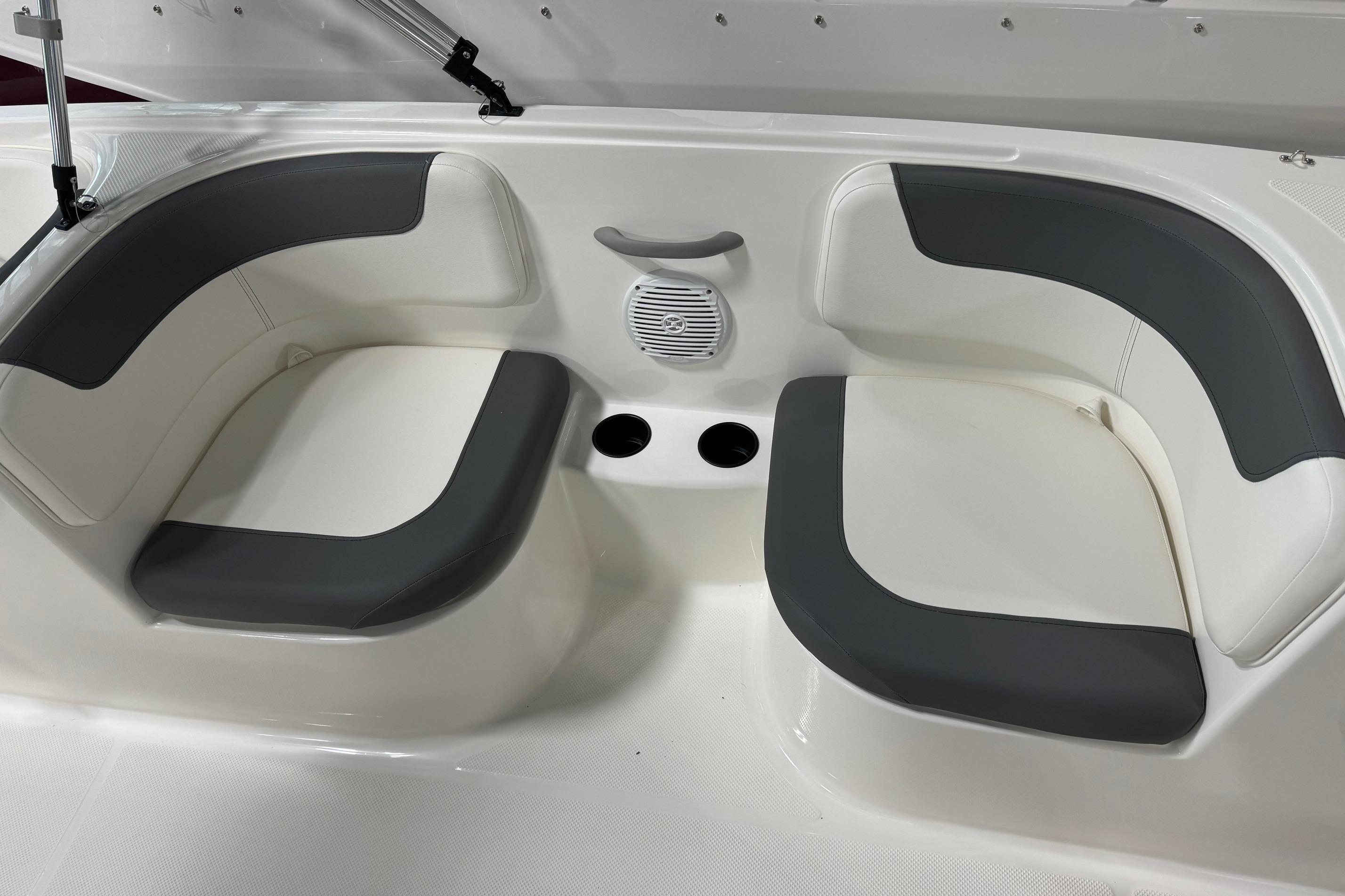 2025 Bayliner Element E18 boat seating area with gray and white cushioned seats.